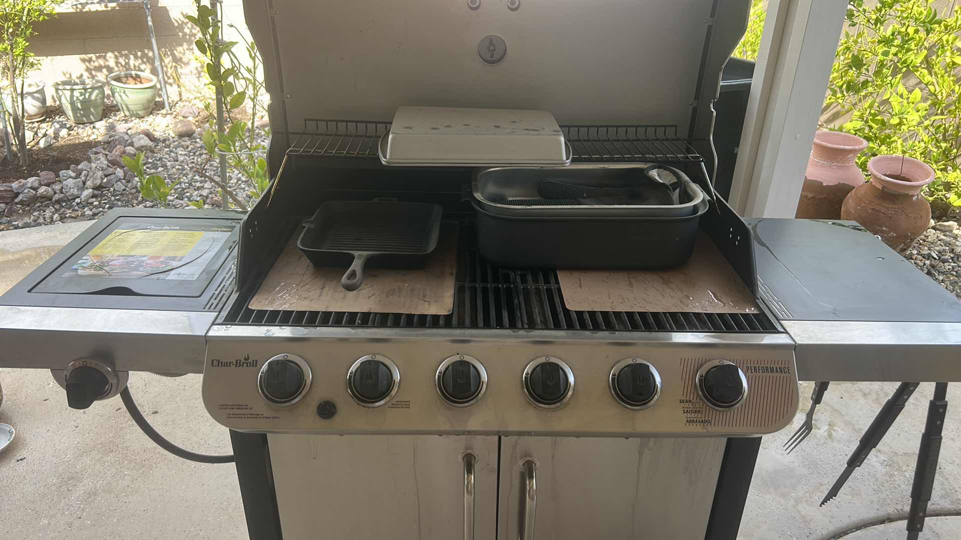 Photo 1 of CHAR-BROIL PERFORMANCE SERIES STAINLESS STEEL 6-BURNER LIQUID PROPANE GAS GRILL WITH 1 LIDDED SIDE BURNER. $500