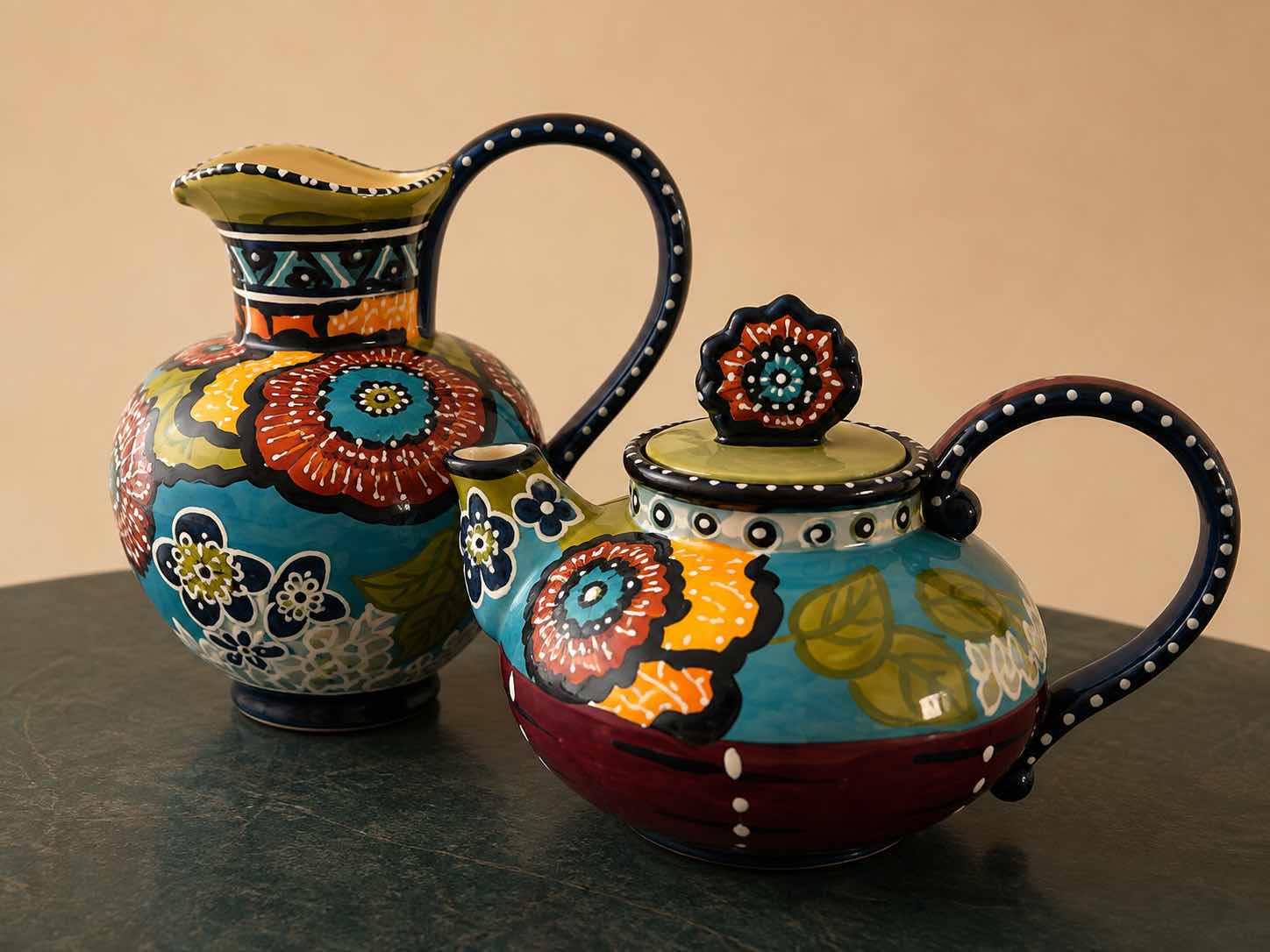 Photo 1 of MATCHING CERAMIC TWO-PIECE SET CONSISTING OF A WATER PITCHER AND A TEAPOT $70