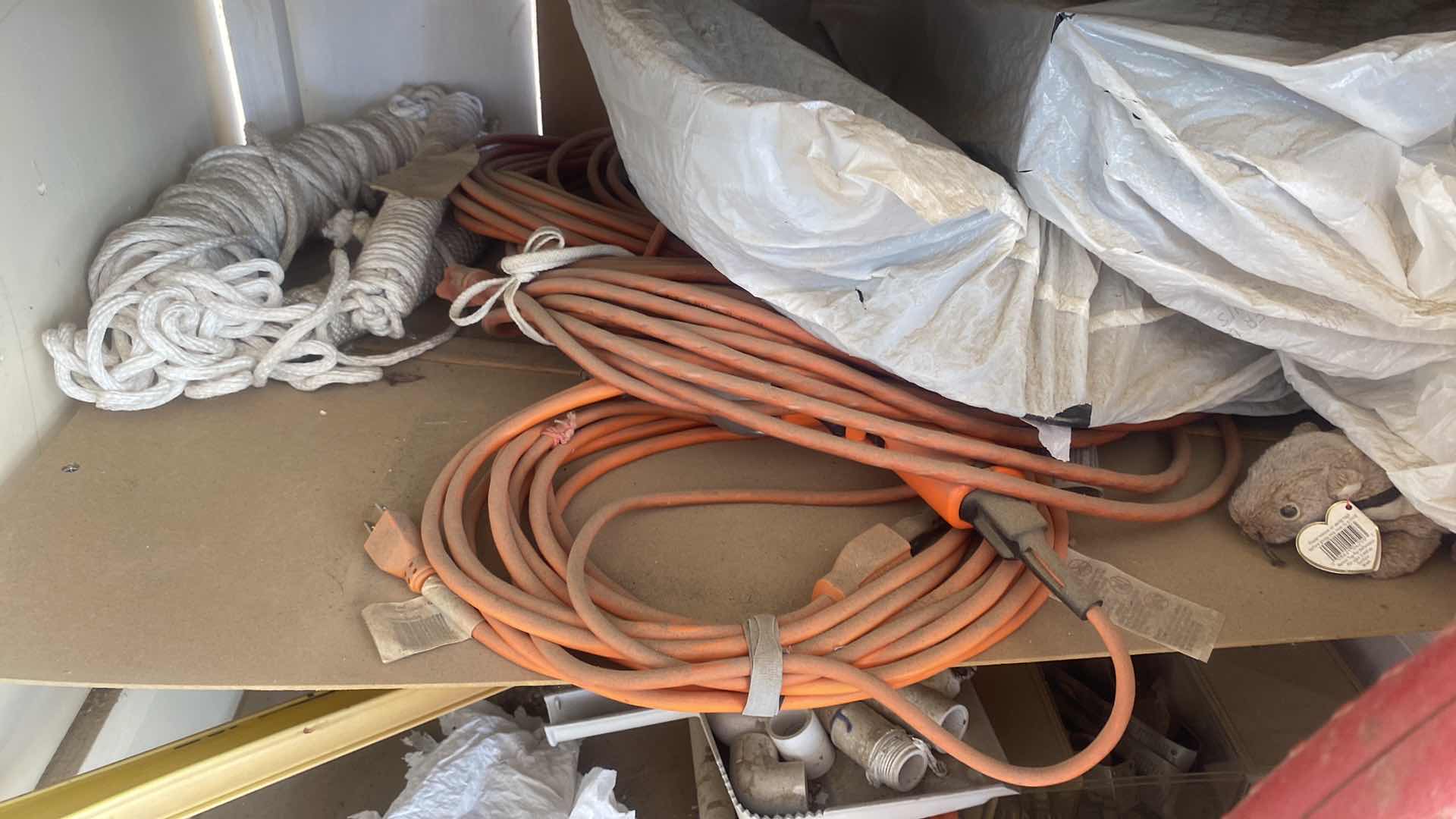 Photo 1 of CONTENTS OF CABINET BACKYARD, YARD BLOWER, LEVELER, NUTS AND BOLTS EXTENSION CORDS AND MORE