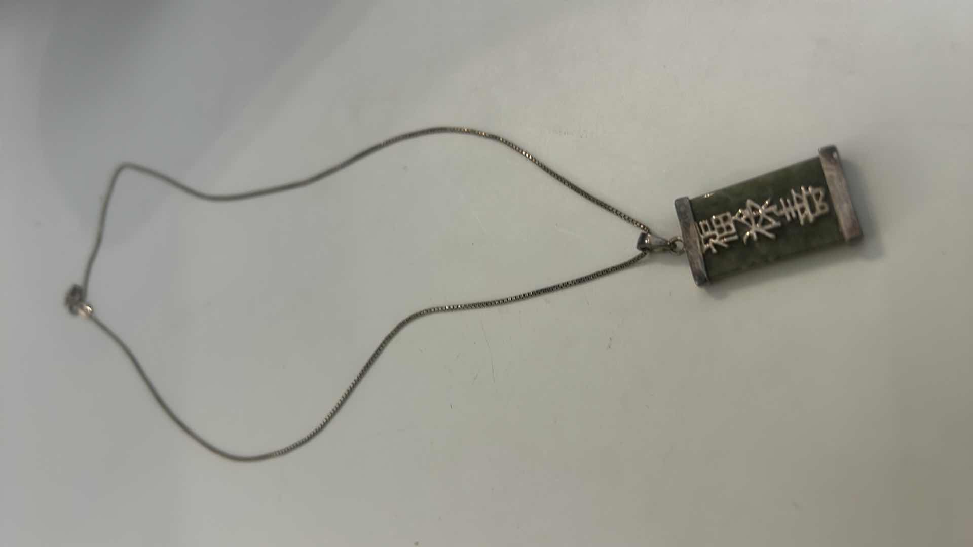 Photo 1 of VINTAGE STERLING SILVER GREEN JADE CHINESE PENDANT ON CHAIN