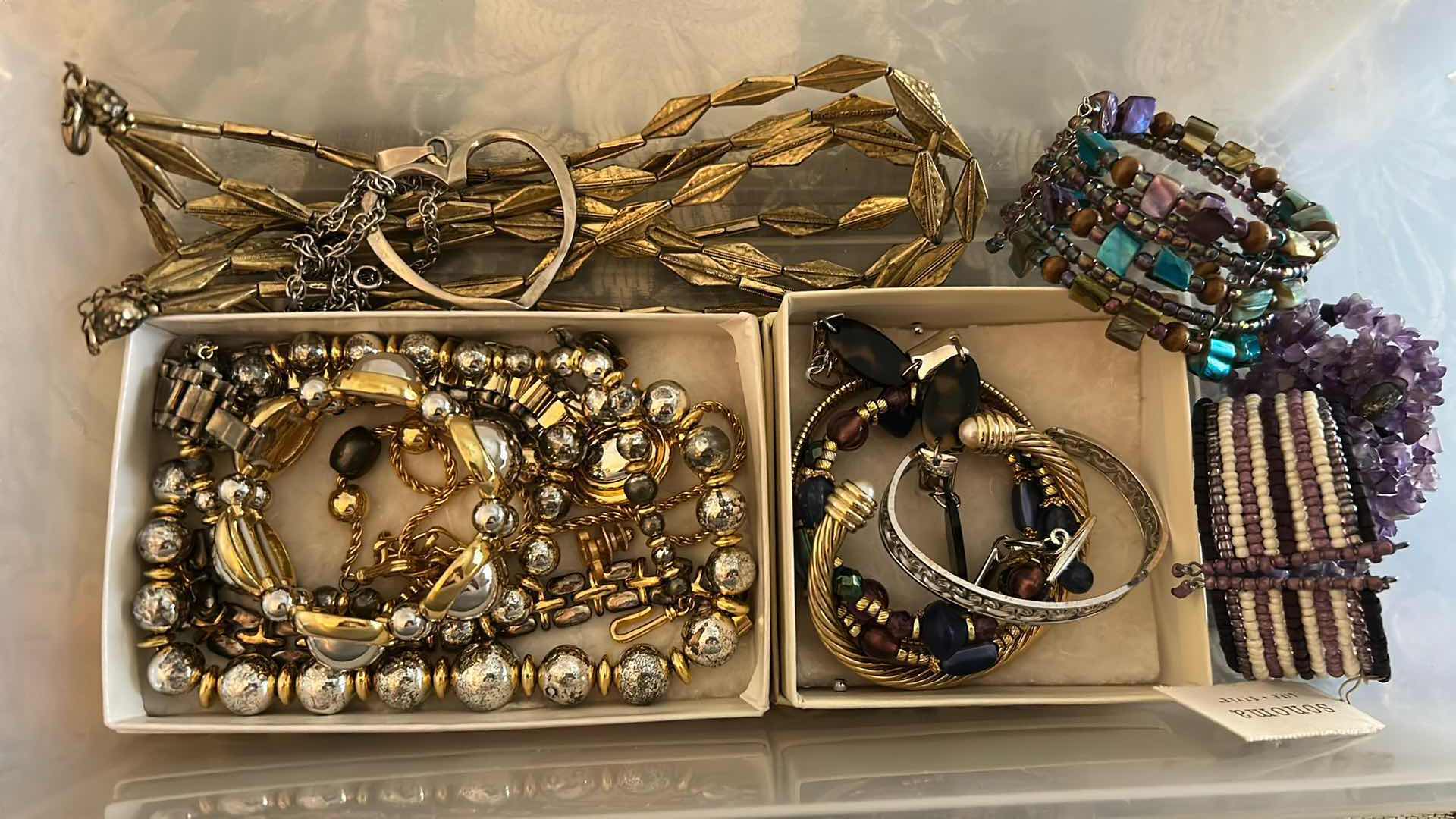 Photo 1 of CONTENTS OF CONTAINER ASSORTED WOMENS COSTUME JEWELRY