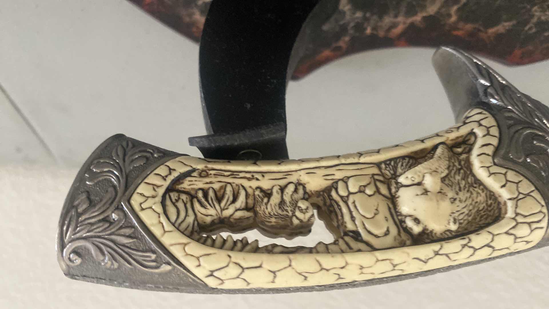 Photo 1 of CARVED HUNTING KNIFE ON STAND 12”