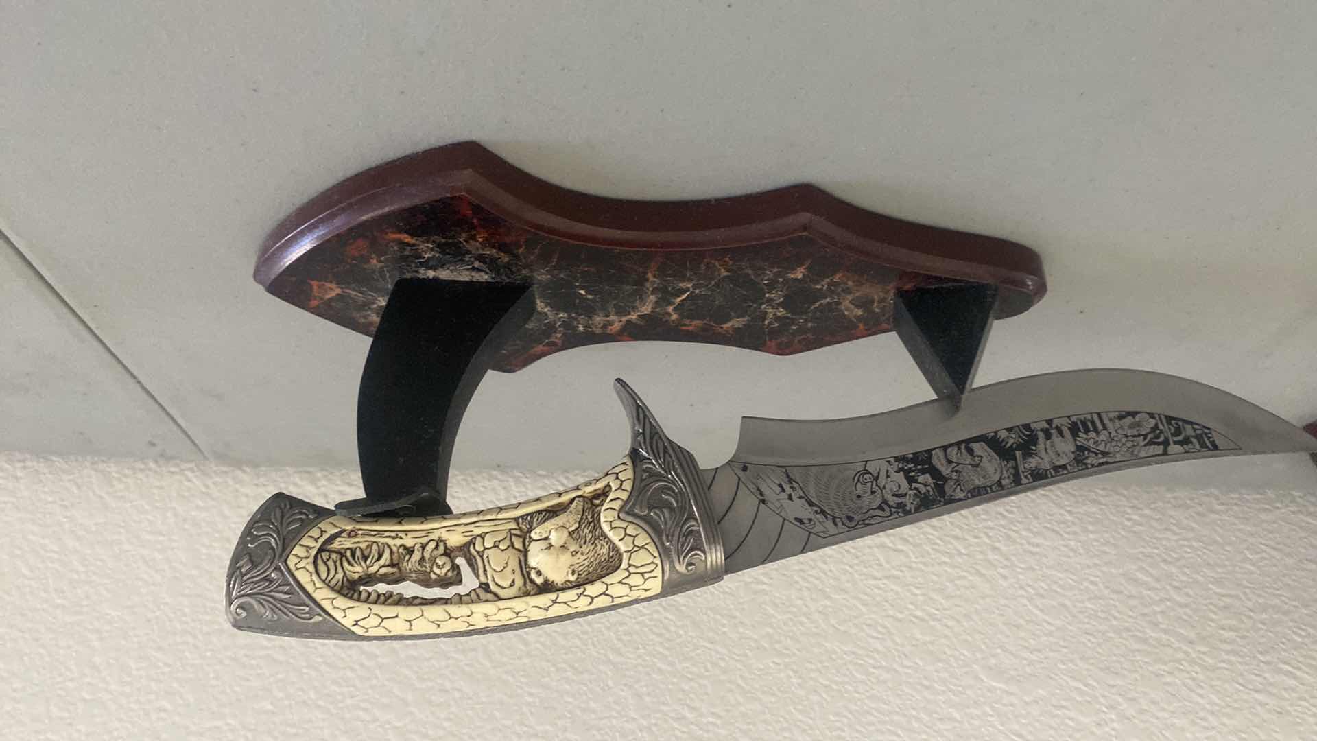 Photo 1 of CARVED HUNTING KNIFE ON STAND 12”