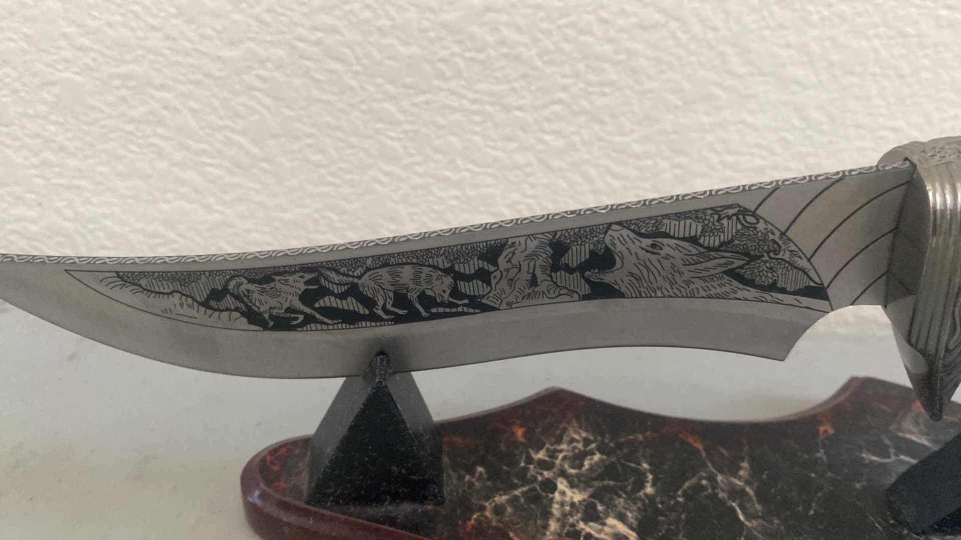 Photo 1 of CARVED HUNTING KNIFE ON STAND 12”