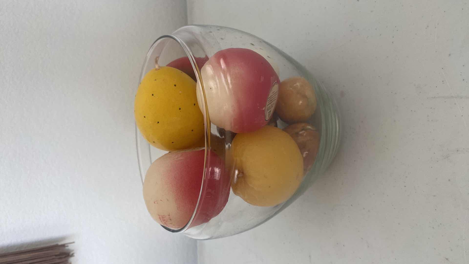 Photo 1 of GLASS BOWL OF FRUIT CANDLES & MARBLE EGGS BOWL IS 6 1/2” x 6”