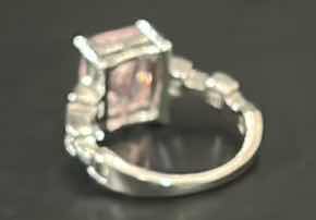Photo 1 of STERLING SILVER RING WITH PINK GEMSTONE ESTIMATED SIZE 6