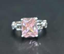 Photo 1 of STERLING SILVER RING WITH PINK GEMSTONE ESTIMATED SIZE 6