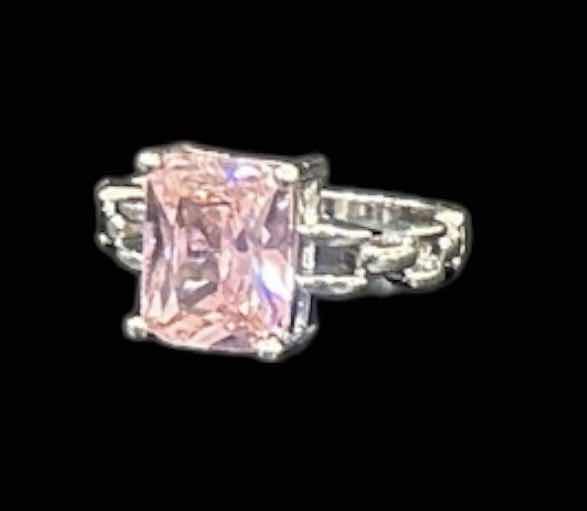 Photo 1 of STERLING SILVER RING WITH PINK GEMSTONE ESTIMATED SIZE 6