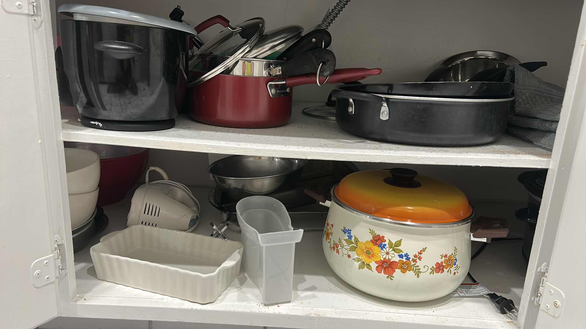 Photo 1 of CONTENTS IN KITCHEN CABINET- POTS AND PANS, CROCKPOT AND MORE