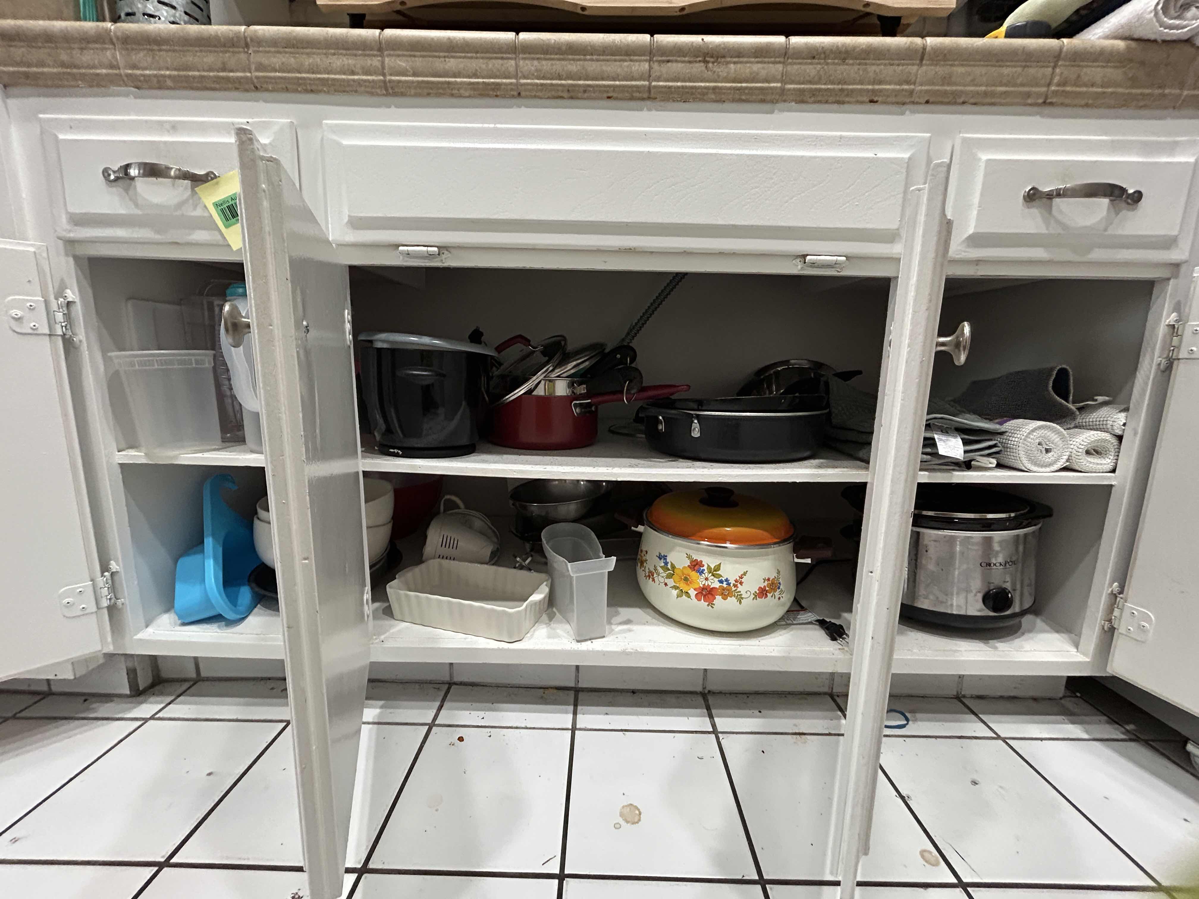 Photo 1 of CONTENTS IN KITCHEN CABINET- POTS AND PANS, CROCKPOT AND MORE
