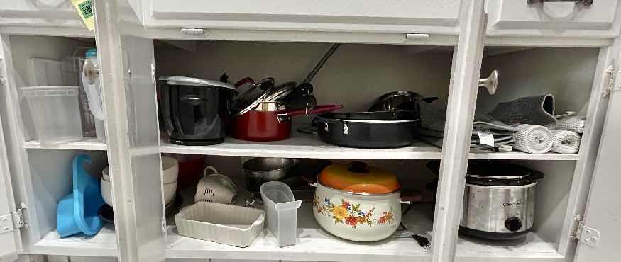 Photo 1 of CONTENTS IN KITCHEN CABINET- POTS AND PANS, CROCKPOT AND MORE