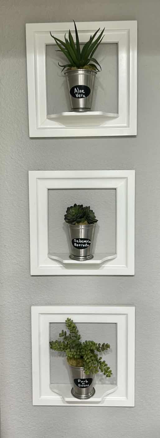 Photo 1 of WHITE WALL MOUNTED PLANTERS SET OF 3. 12” x 12”