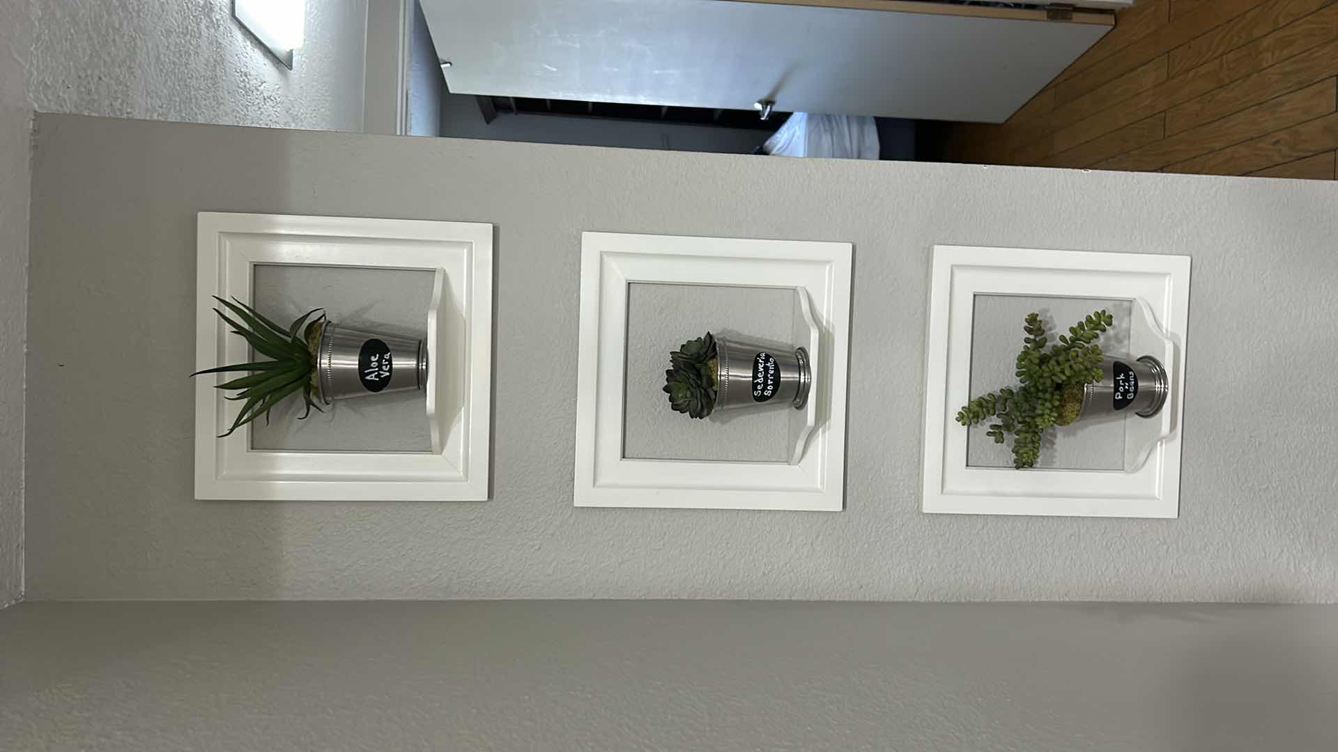 Photo 1 of WHITE WALL MOUNTED PLANTERS SET OF 3. 12” x 12”