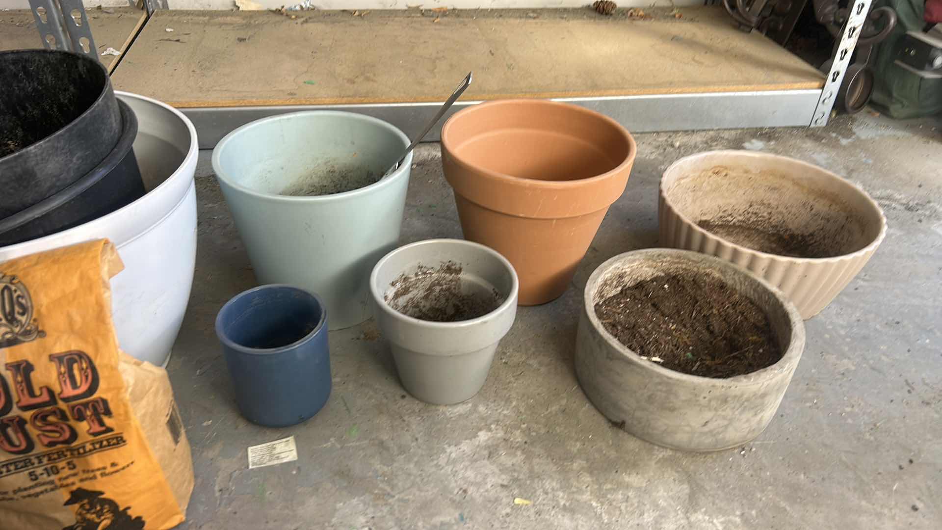 Photo 1 of GARDENING SUPPLIES- POTS AND FERTILIZER
