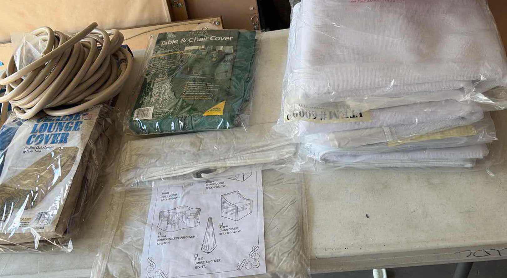 Photo 1 of CONTENTS OF BOX OUTDOOR NETTING, CHAIR COVERS, MIST HOSES