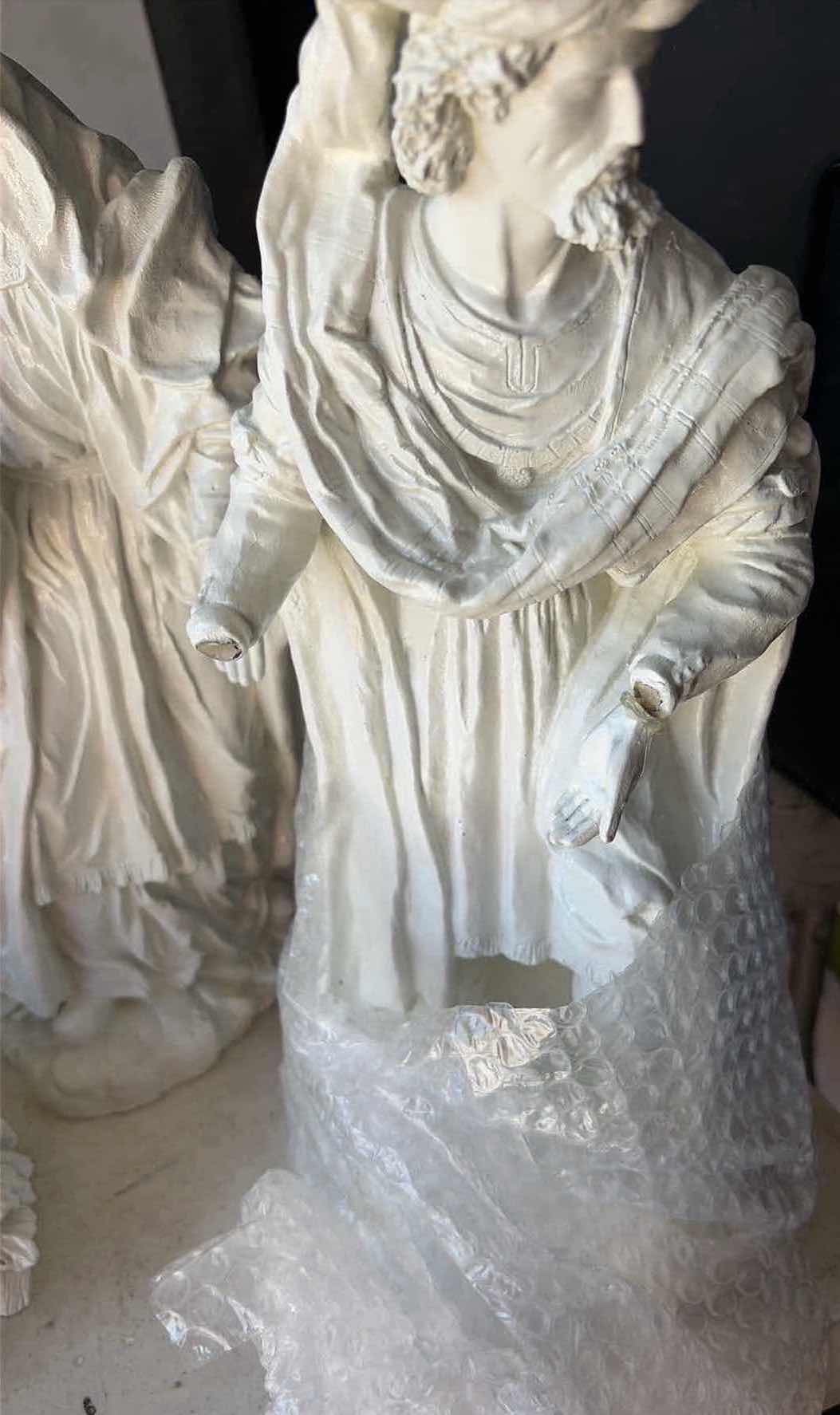 Photo 1 of CONTENTS OF TOTE- RELIGIOUS STATUES