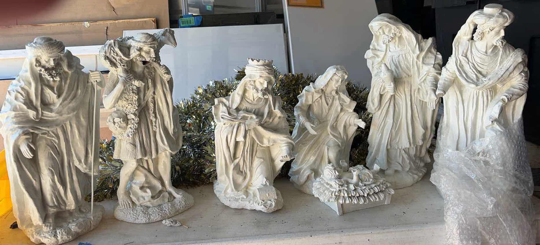 Photo 1 of CONTENTS OF TOTE- RELIGIOUS STATUES
