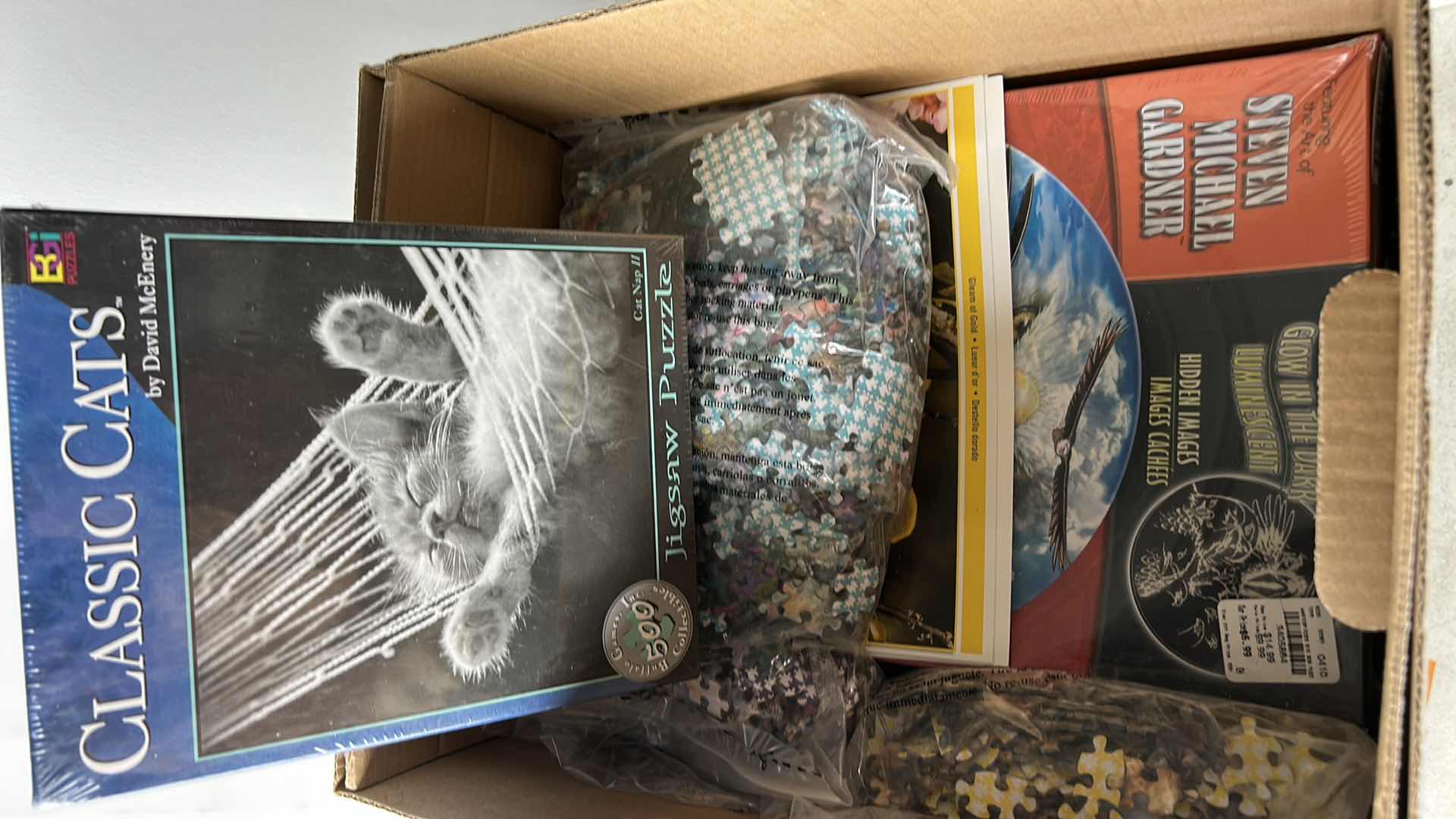 Photo 1 of BOX OF PUZZLES