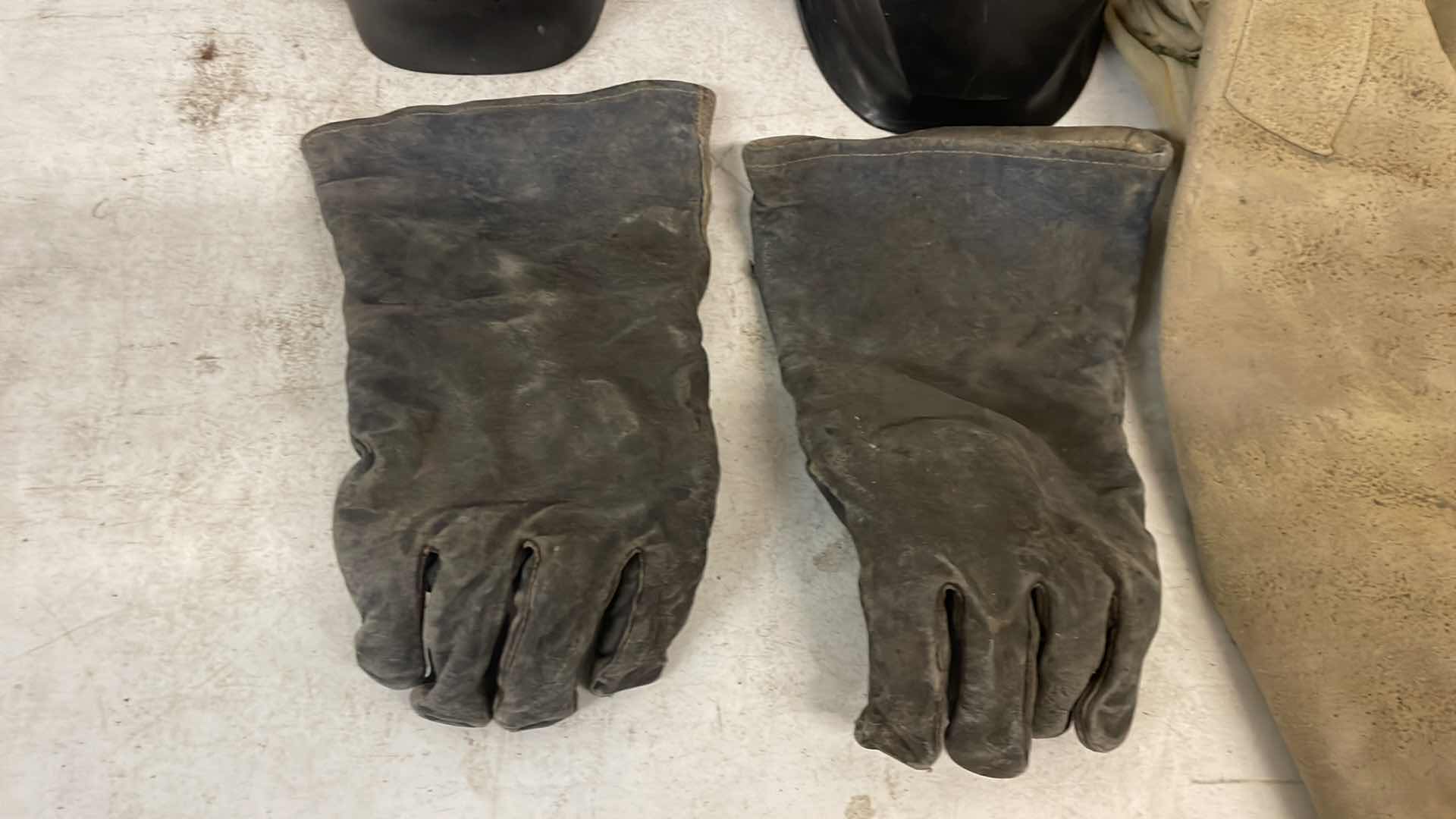 Photo 1 of WELDING HELMETS GLOVES AND RADNOR XL LEATHER JACKET