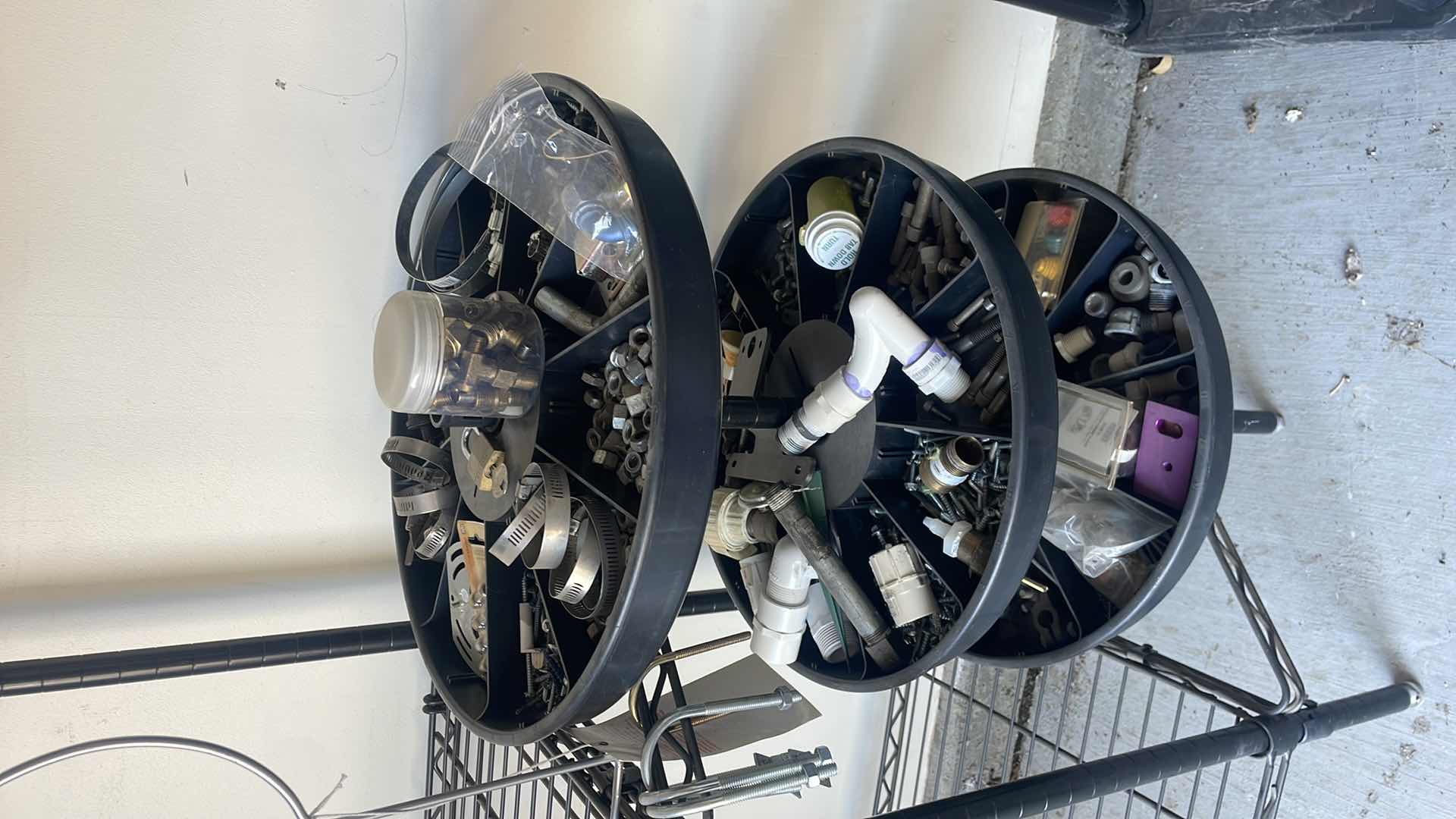 Photo 1 of PROFESSIONAL CHOICE 4 SHELF WIRE RACK PLUS CAROUSEL ATTACHMENT ON END WITH CONTENTS