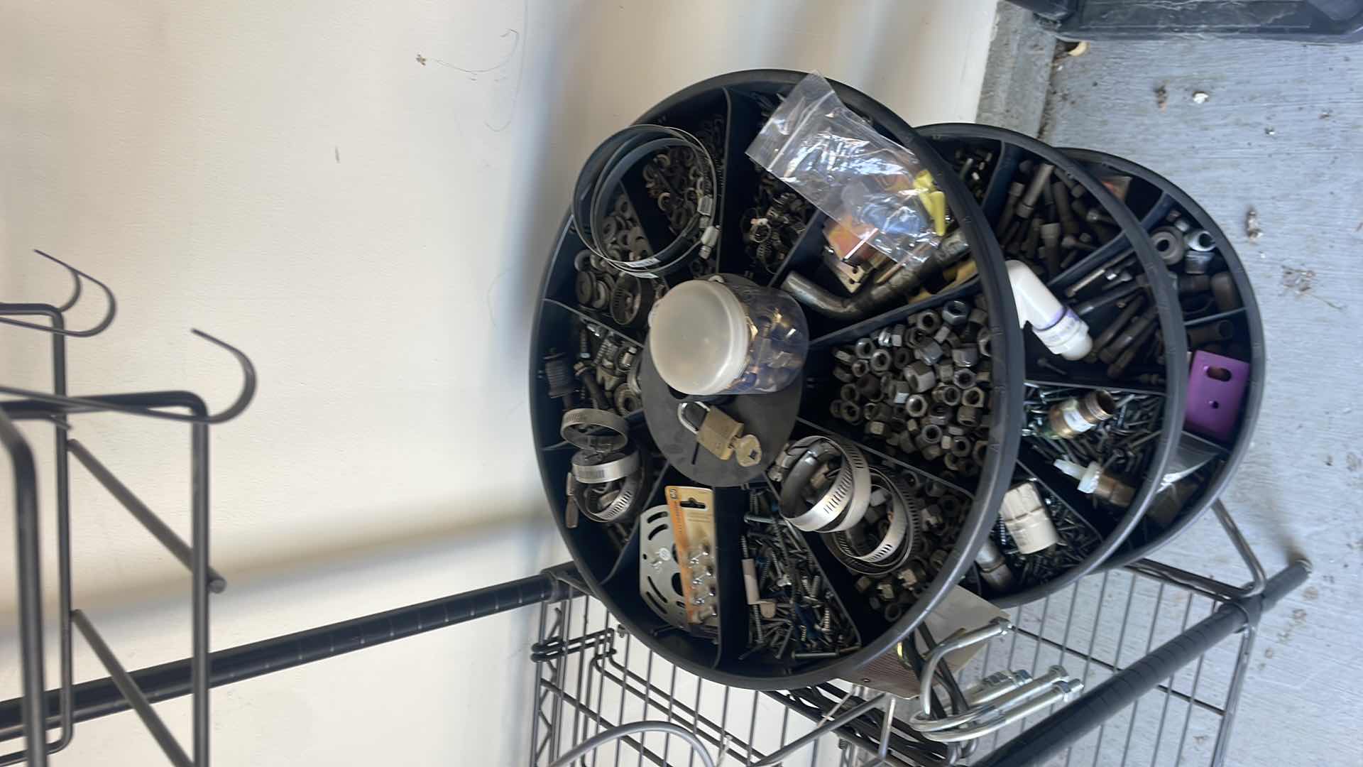 Photo 1 of PROFESSIONAL CHOICE 4 SHELF WIRE RACK PLUS CAROUSEL ATTACHMENT ON END WITH CONTENTS