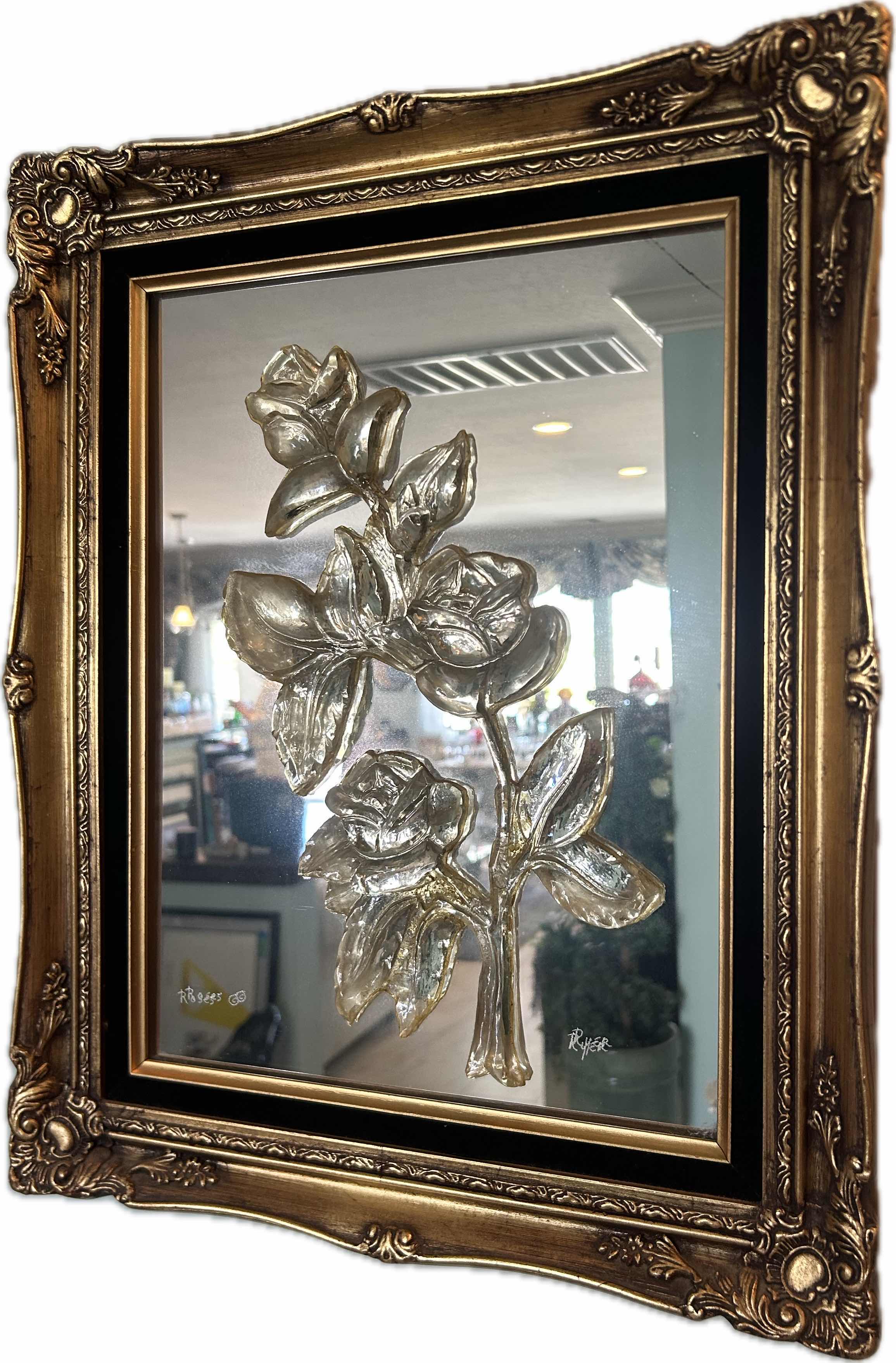 Photo 1 of DECORATIVE MIRROR W AN ORNATE GOLD COLORED FRAME AND RAISED METALLIC FLORAL 17" X 20"