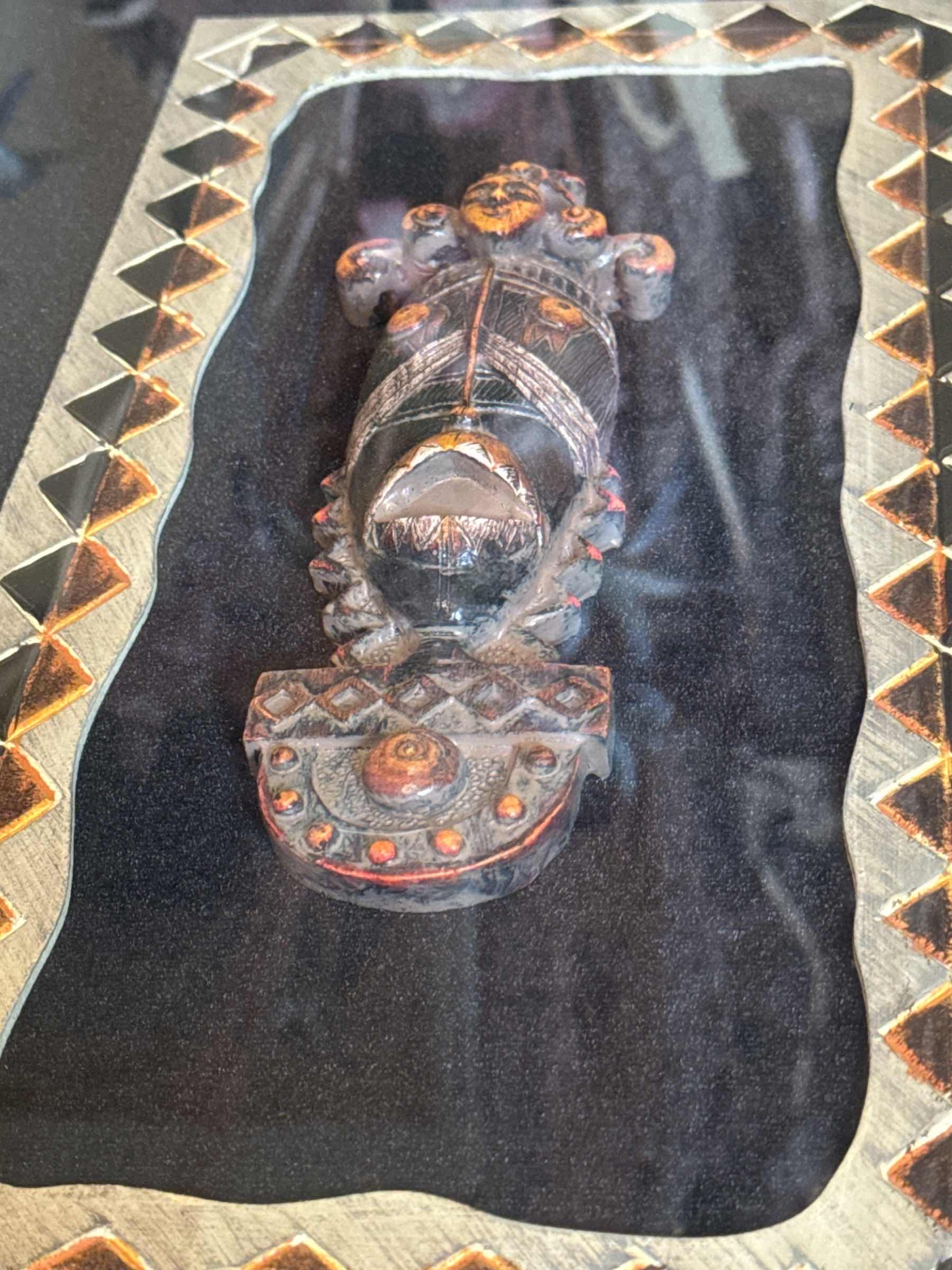 Photo 1 of VINTAGE RESIN AND WOOD SHADOW BOX CONTAINING AFRICAN HAND CARVED PENDANT 
20” X 2.75” X H26”

$85