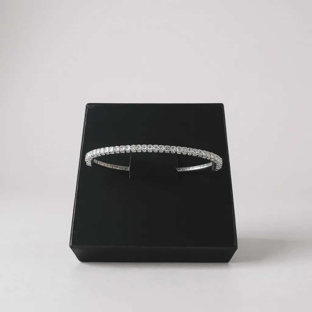 Photo 1 of 18K WHITE GOLD W 0.50 ctw DIAMOND BANGLE BRACELET TTL GRAMS 14.35 W INSURANCE APPRAISAL ITEM # 2015