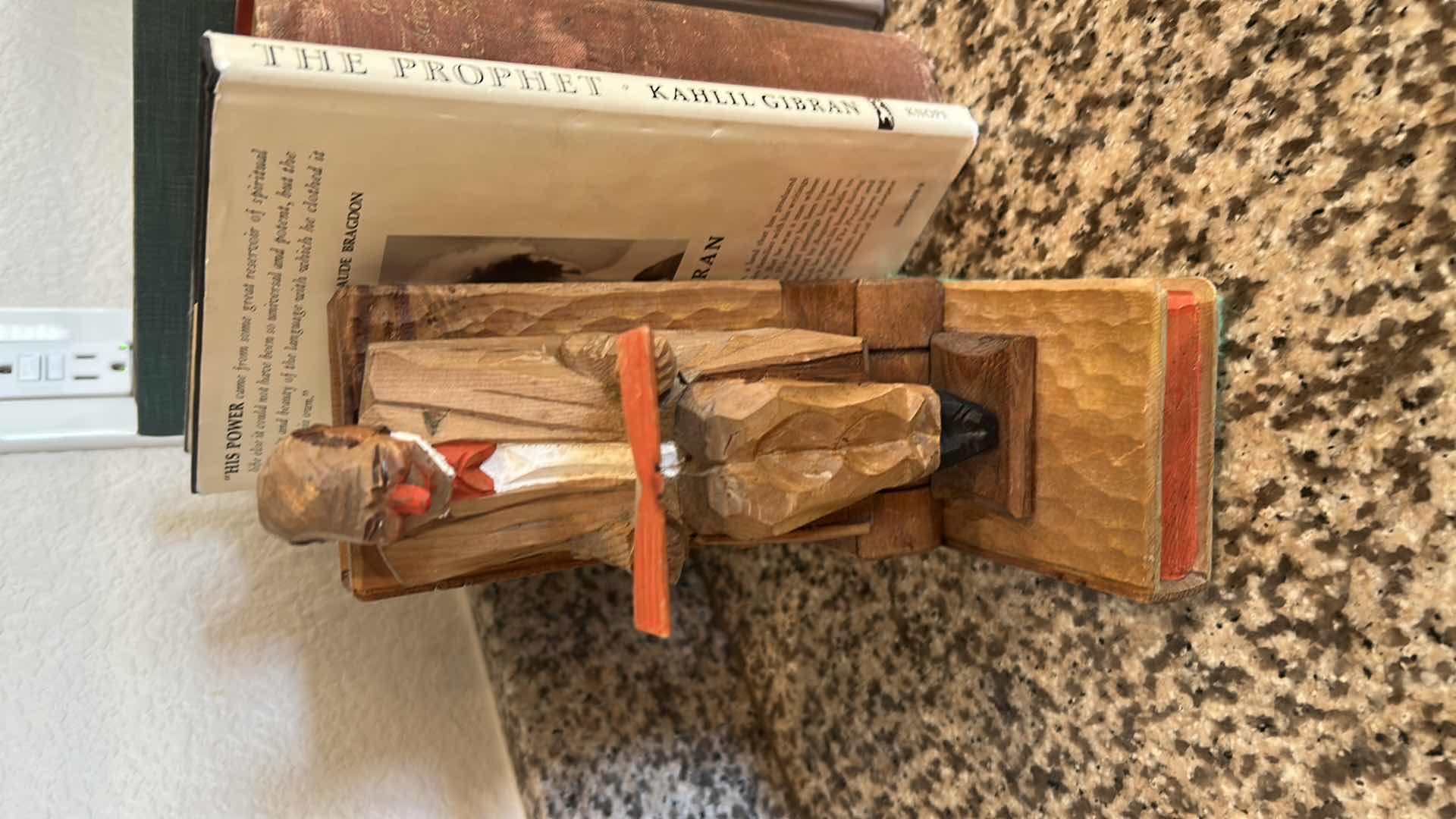 Photo 1 of TWO CARVED WOODEN BOOKENDS W 14 BOOKS