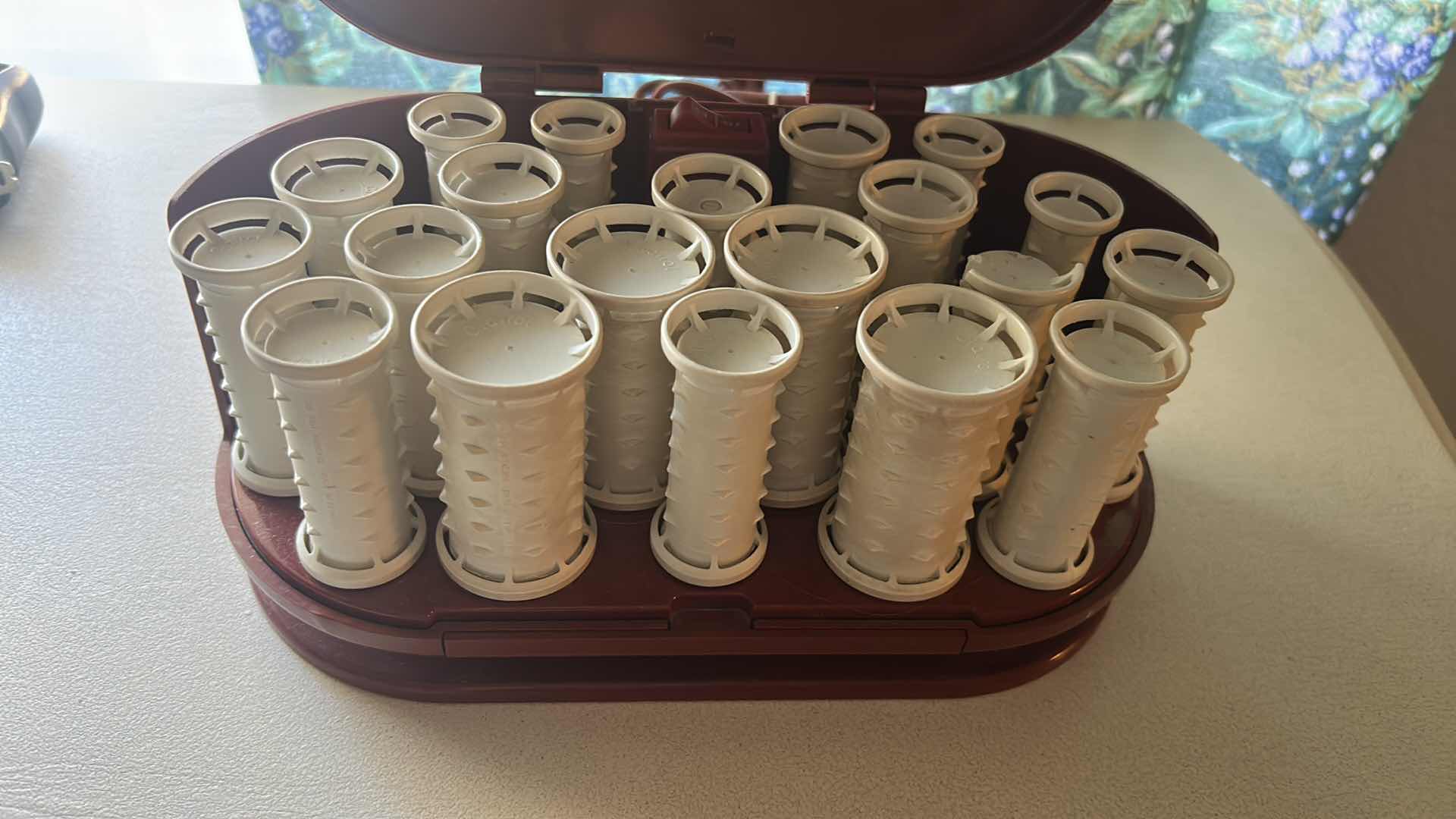 Photo 1 of CLAIROL HOT ROLLERS W BAG OF CLIPS