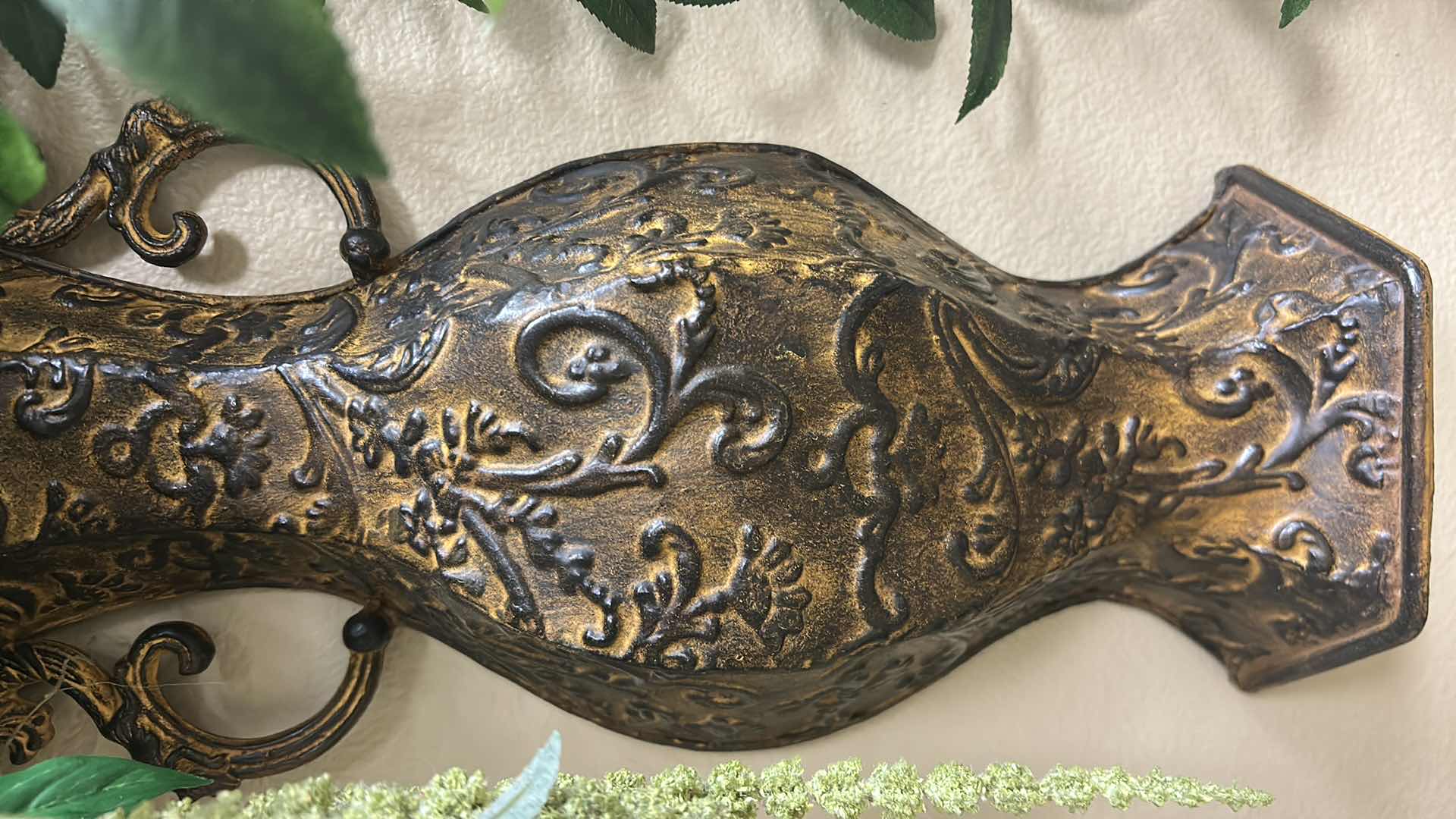 View 2 of FAUX TRAILING GREENERY IN A METAL BRONZE ORNATE WALL VASE H 25"