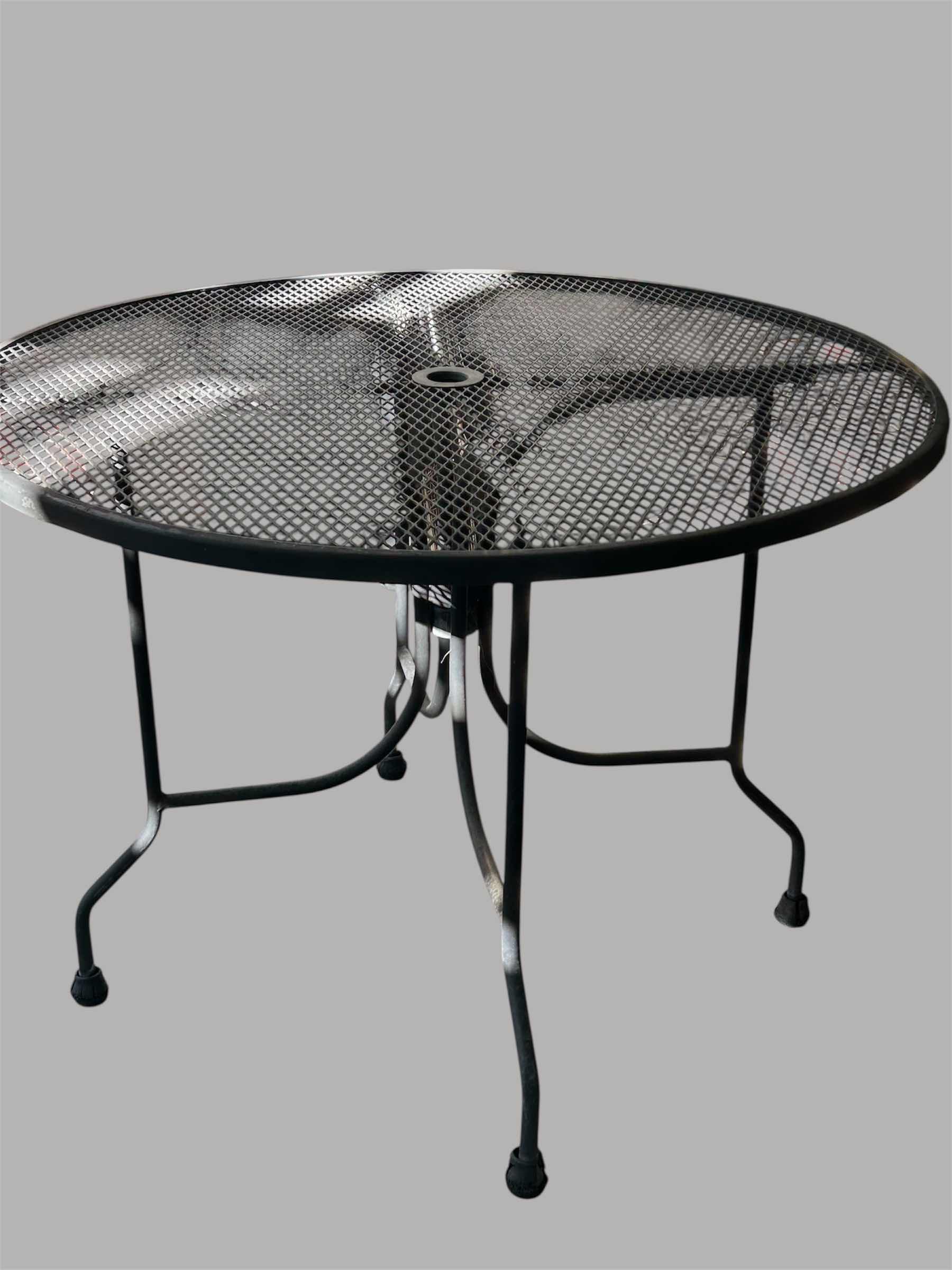 Photo 1 of ROUND BLACK METAL MESH OUTDOOR PATIO TABLE W UMBRELLA HOLE 42"
