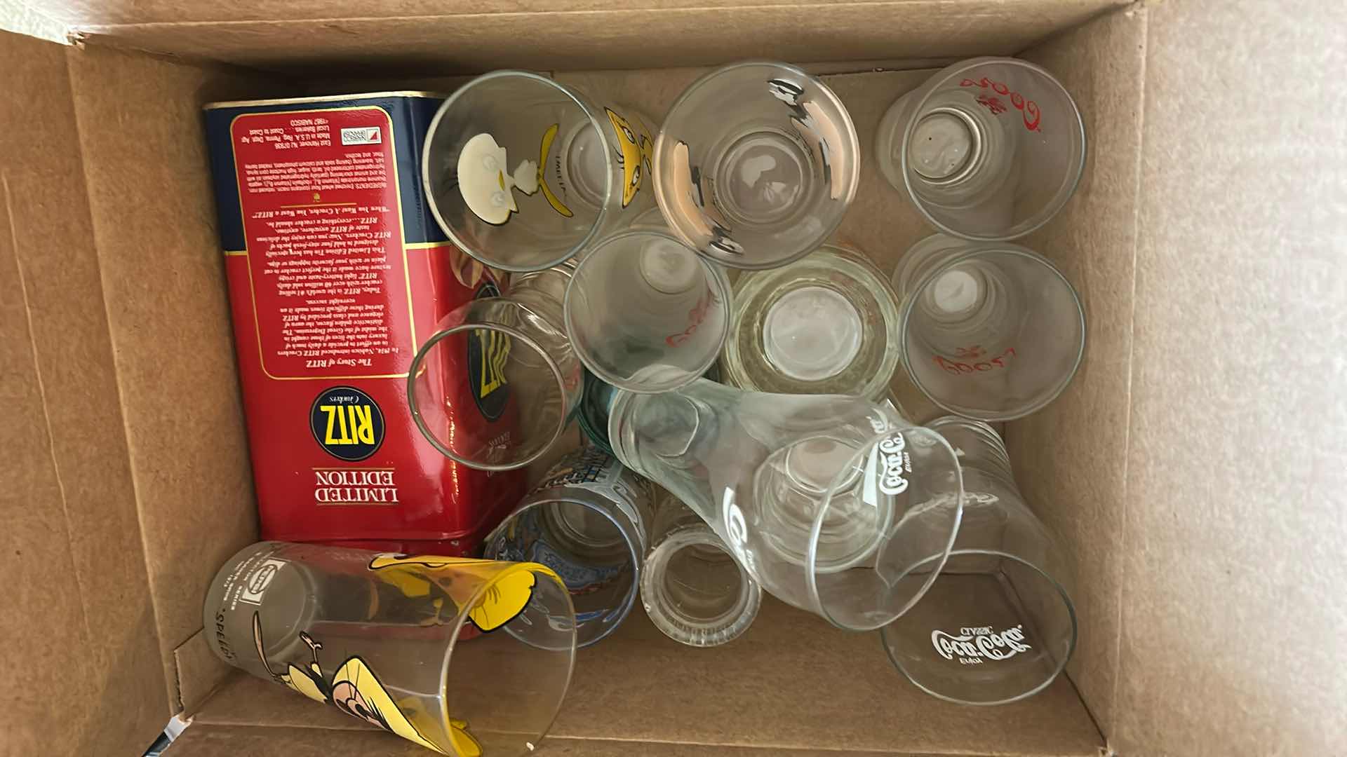 Photo 1 of CONTENTS OF BOX ASSORTED GLASSES NORMAN ROCKWELL PRINT