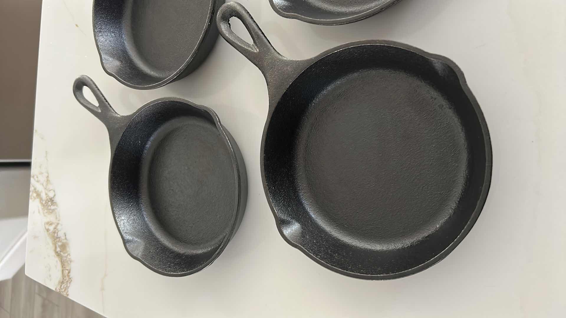 Photo 1 of 4-LODGE PRE SEASONED CAST IRON MINI SKILLETS