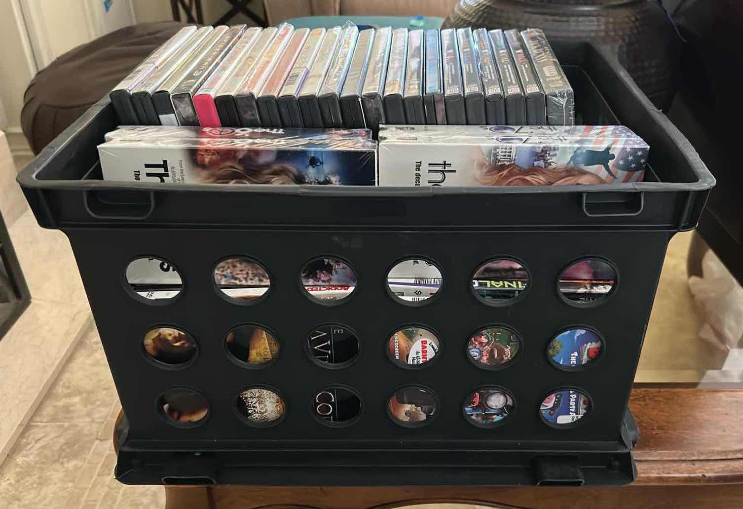 Photo 1 of CONTENTS OF PLASTIC BIN ASSORTMENT OF DVD'S