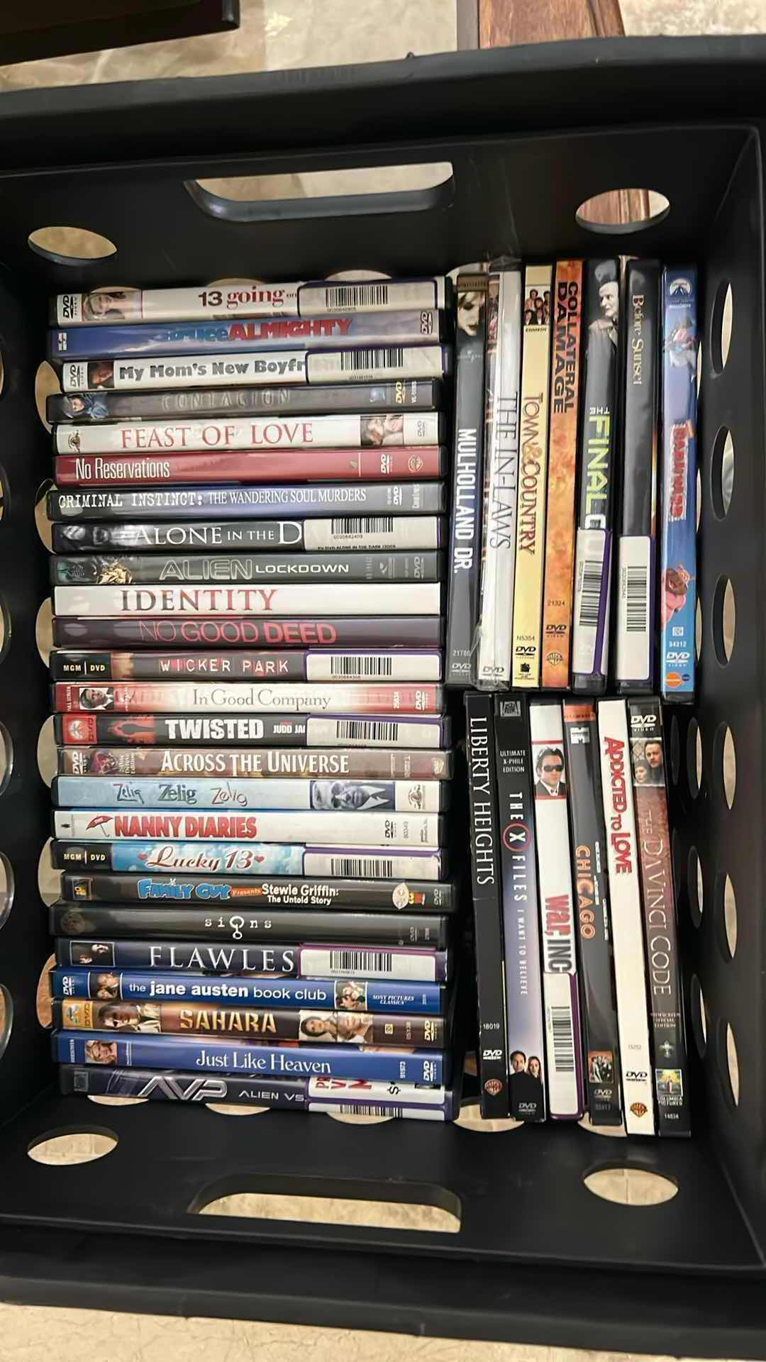 Photo 1 of CONTENTS OF PLASTIC BIN ASSORTMENT OF DVD'S