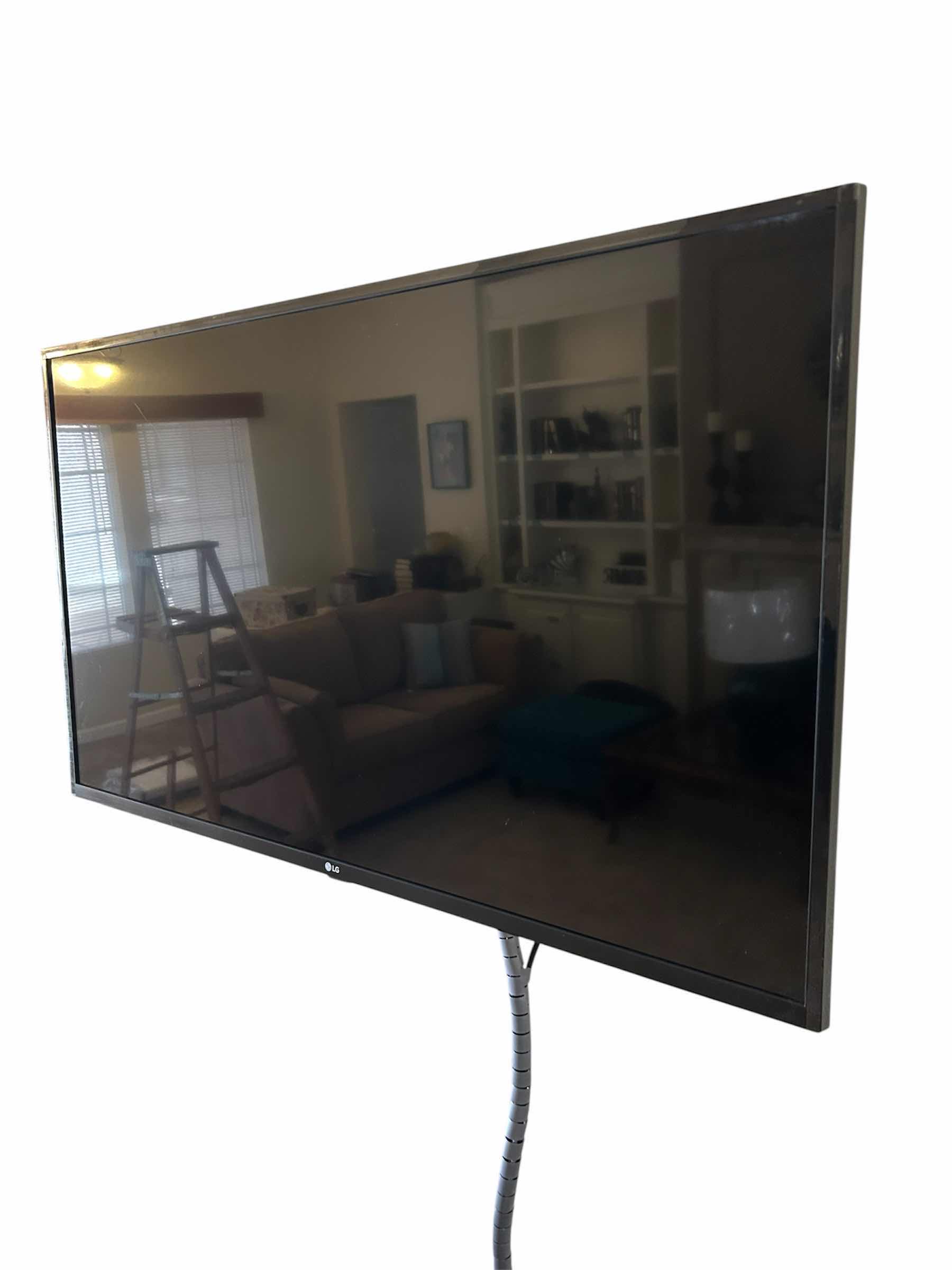 Photo 1 of 42" LG WALL MOUNT TV W REMOTE