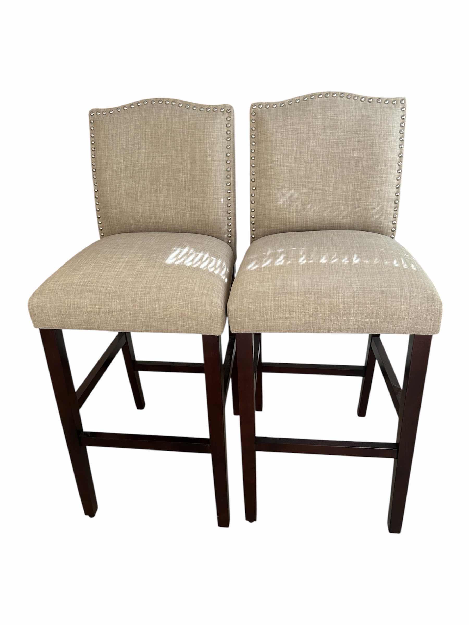 Photo 1 of 2- BEIGE UPHOLSTERED COUNTER STOOLS W NAILHEAD TRIM H 44"