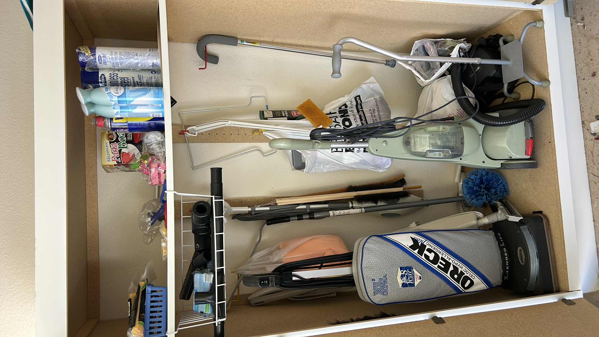 Photo 1 of CONTENTS IN CABINET, ORECK VACUUM, FLOOR CLEANER AND MORE