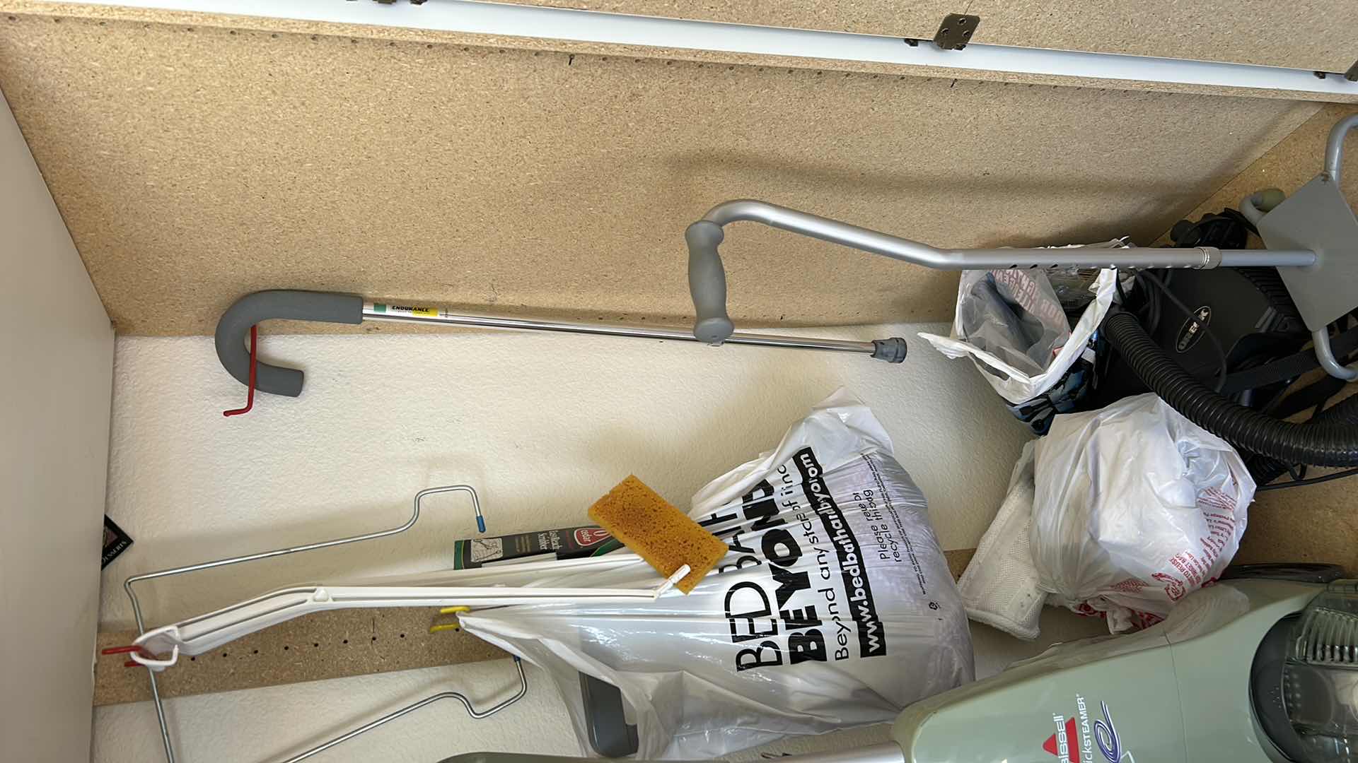 Photo 1 of CONTENTS IN CABINET, ORECK VACUUM, FLOOR CLEANER AND MORE