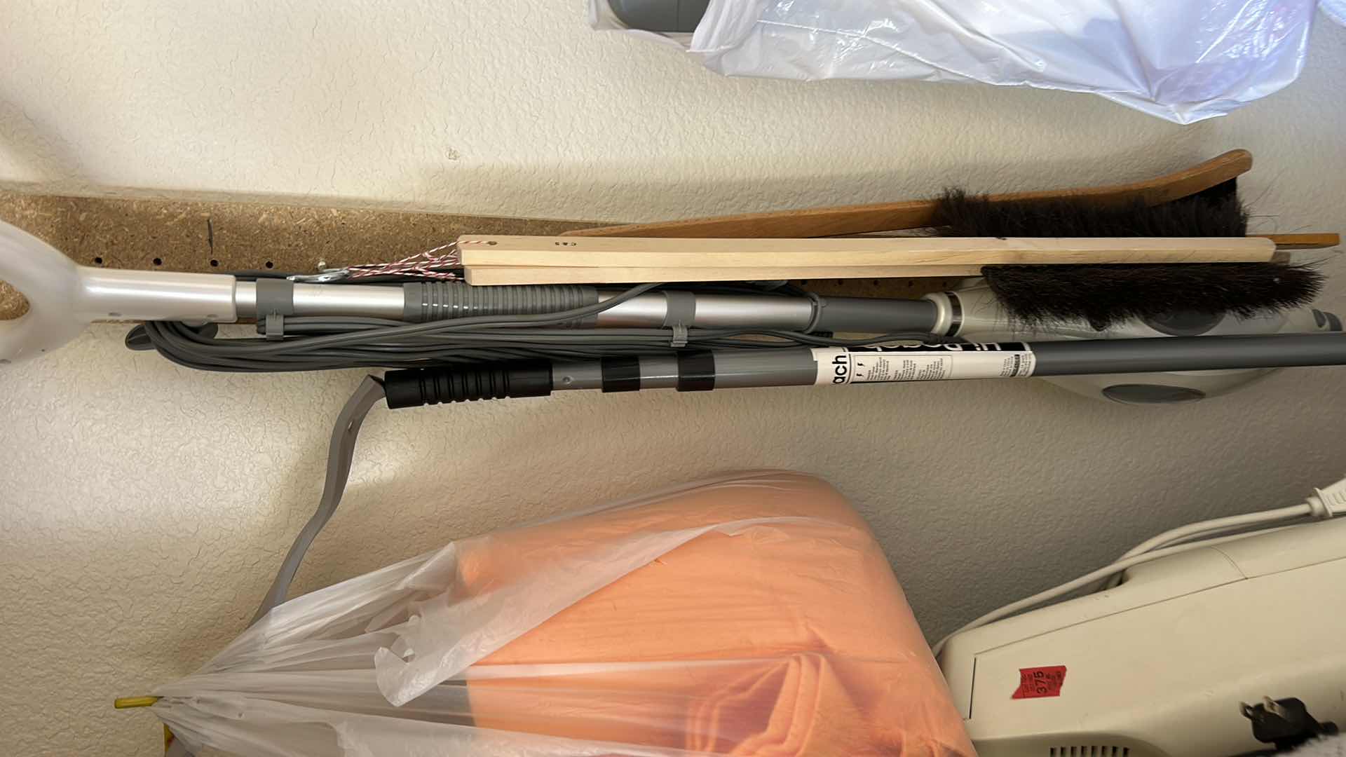 Photo 1 of CONTENTS IN CABINET, ORECK VACUUM, FLOOR CLEANER AND MORE