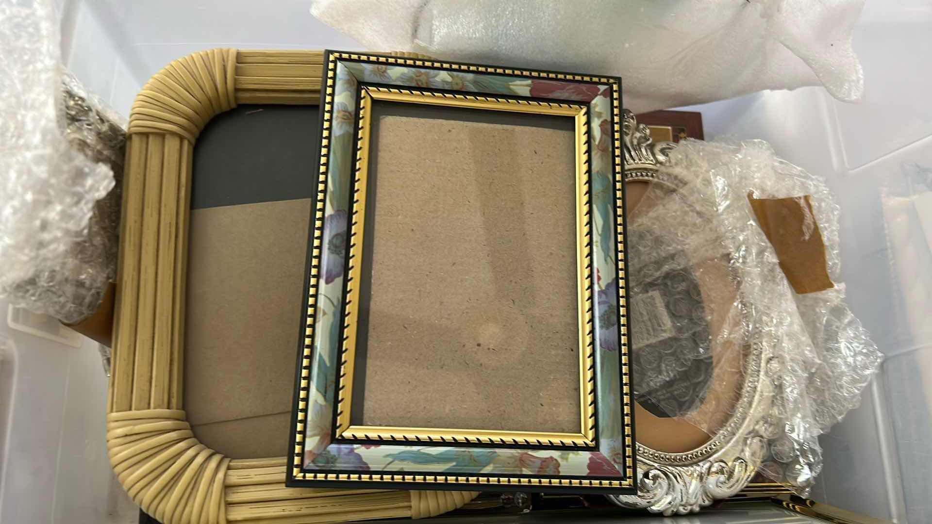 Photo 1 of CONTENTS OF PLASTIC CONTAINER ASSORTED PICTURE FRAMES