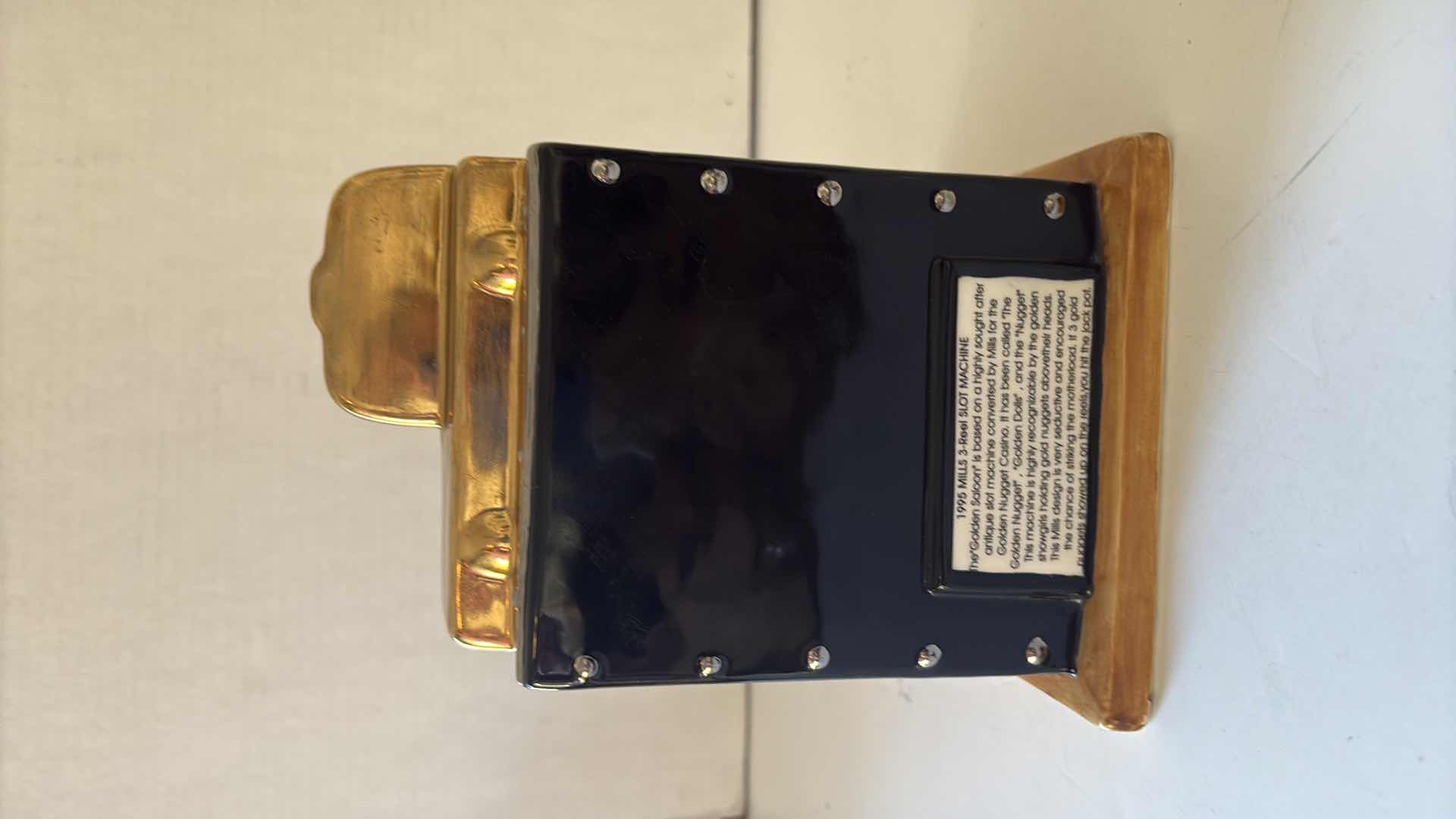 Photo 1 of J BAILEY 1995  THE GOLDEN SALOON MILLS 3 REEL SLOT MACHINE COIN BANK