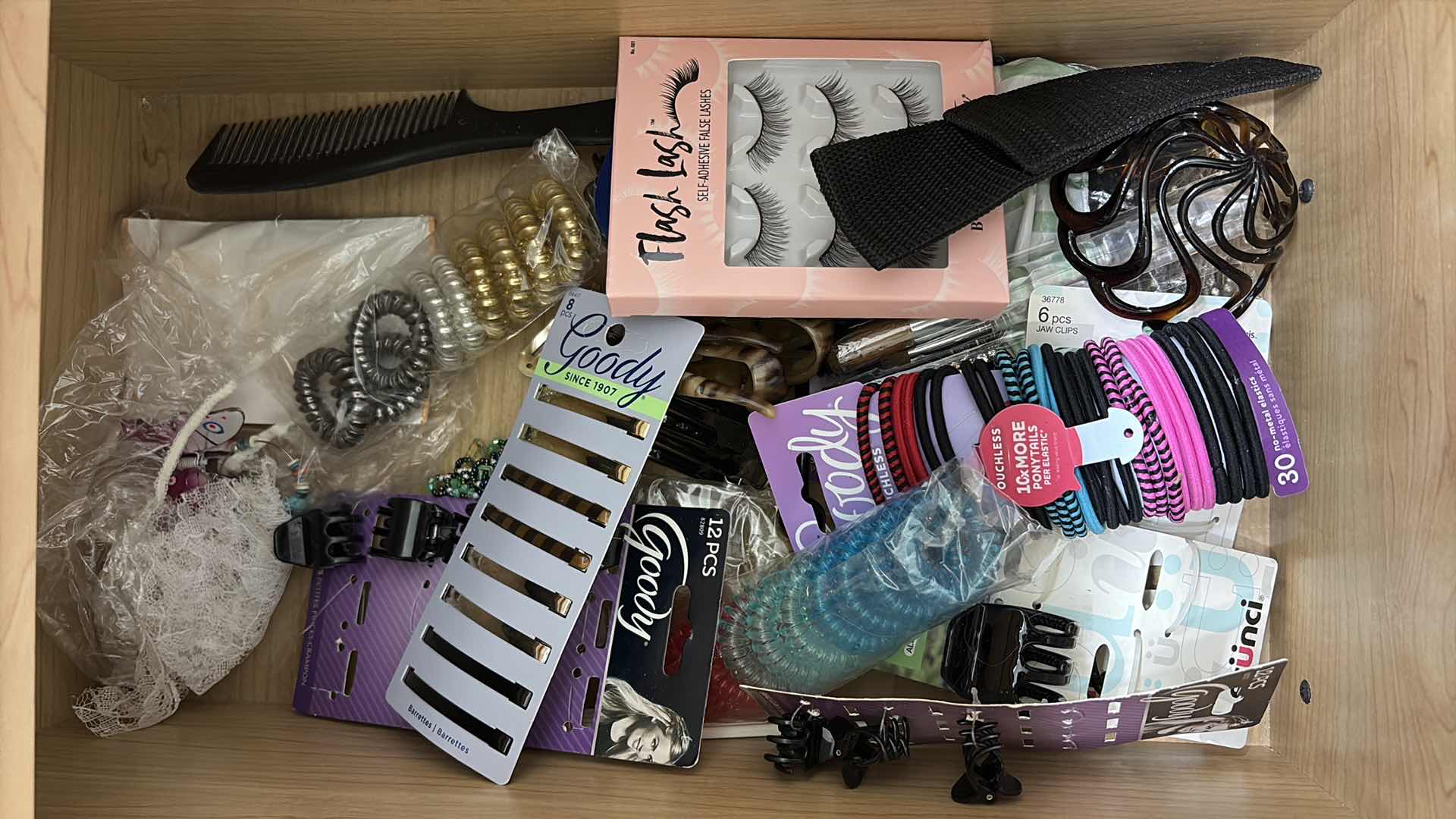 Photo 1 of CONTENTS OF PRIMARY BATHROOM DRAWERS-MAKEUP,EYELASHES & HAIR ITEMS