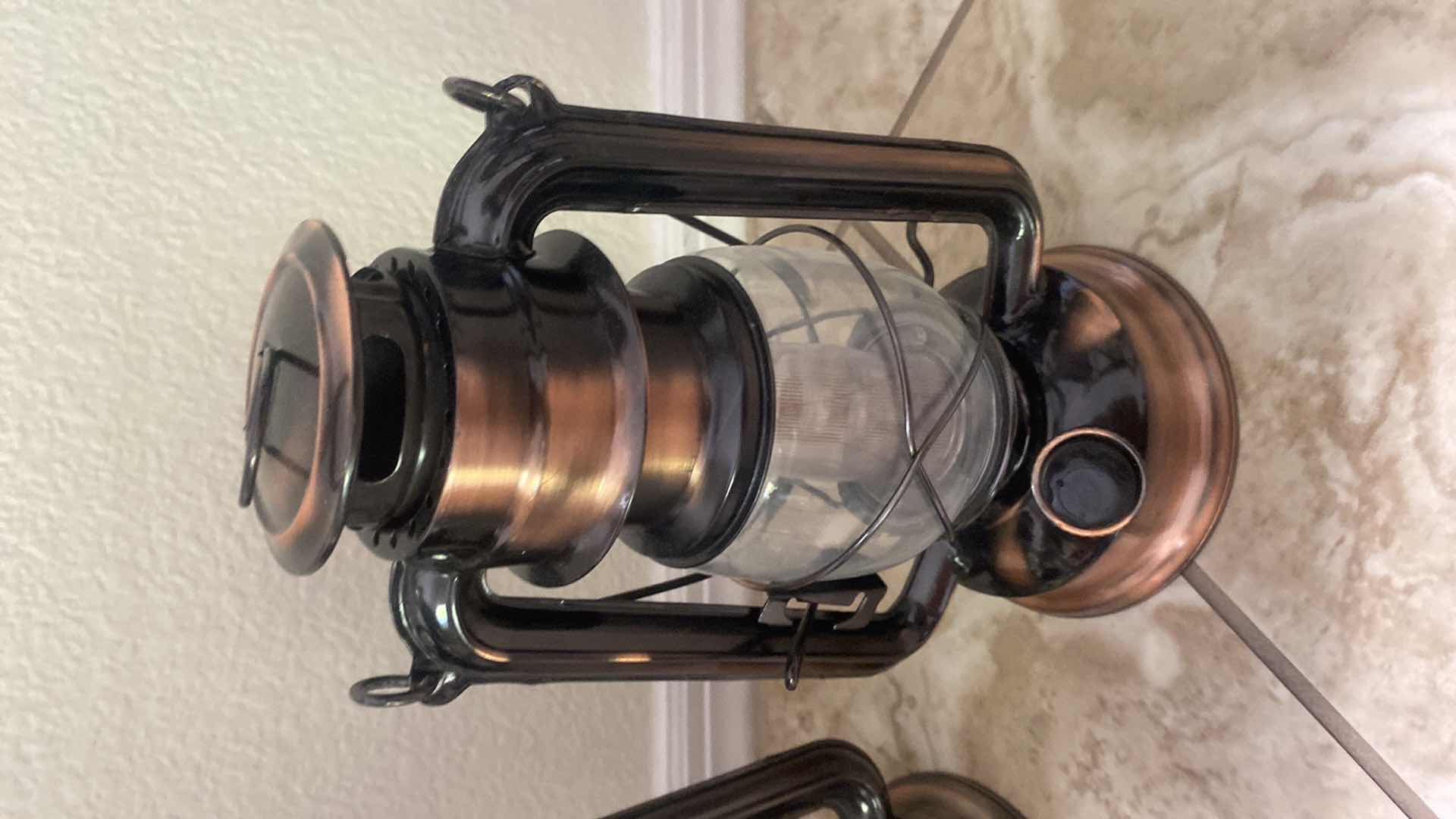 Photo 1 of 4-LANTERNS, ONE SOLAR POWERED THREE BATTERY OPERATED H9 1/2”