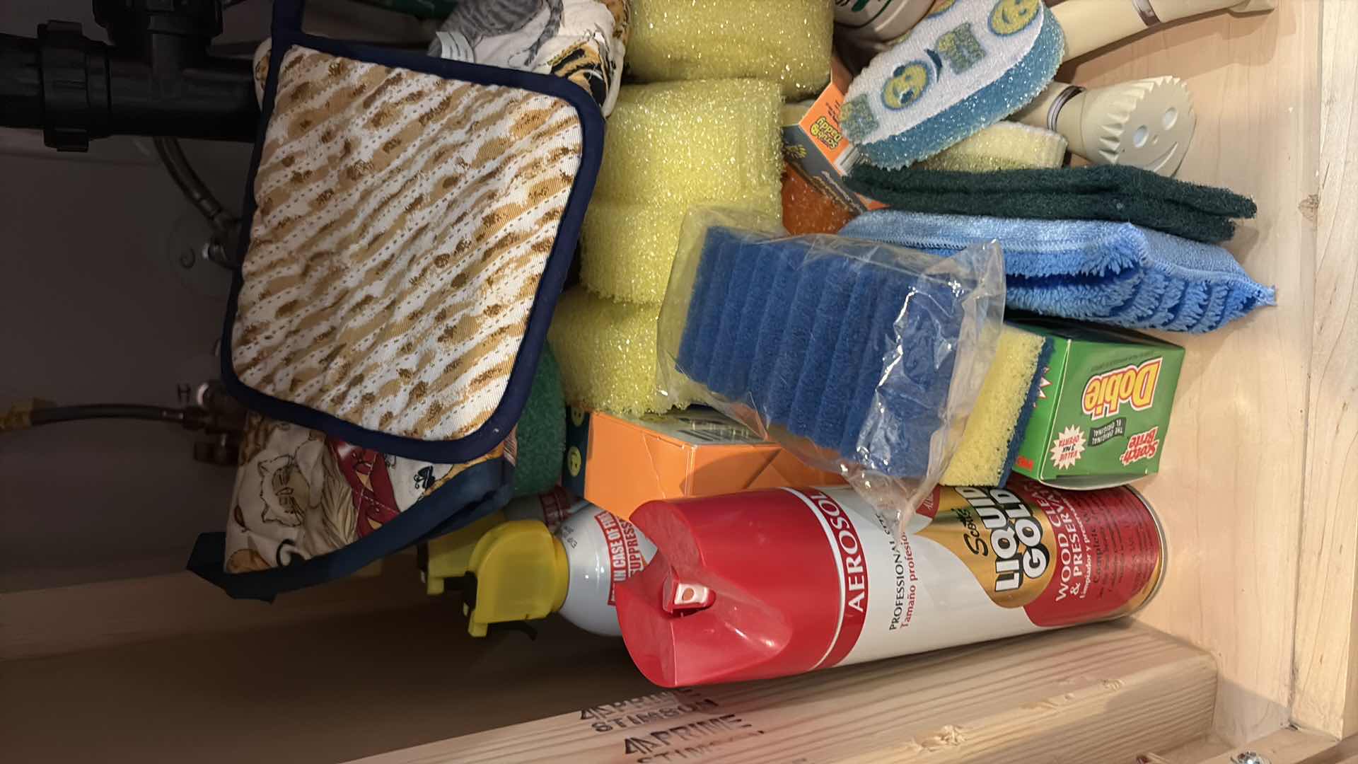 Photo 1 of CONTENTS OF CABINET UNDERNEATH SINK