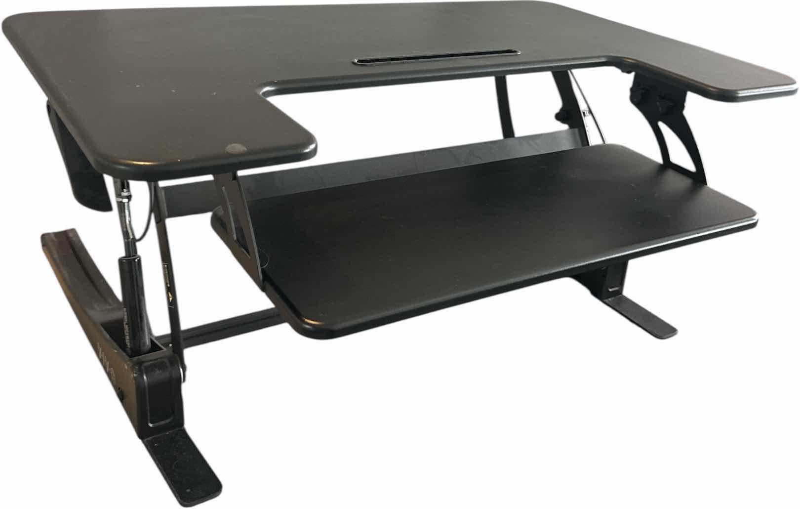 Photo 1 of HEIGHT ADJUSTABLE BLACK STANDING DESK
36.26 X 25” x H 16.75