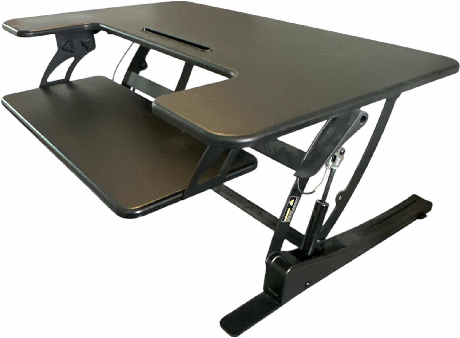 Photo 1 of HEIGHT ADJUSTABLE BLACK STANDING DESK
36.26 X 25” x H 16.75