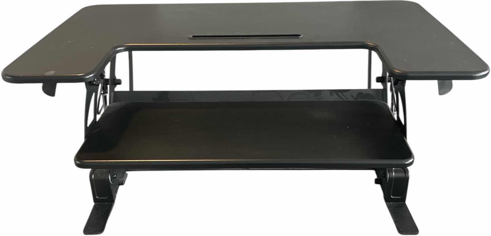 Photo 1 of HEIGHT ADJUSTABLE BLACK STANDING DESK
36.26 X 25” x H 16.75
