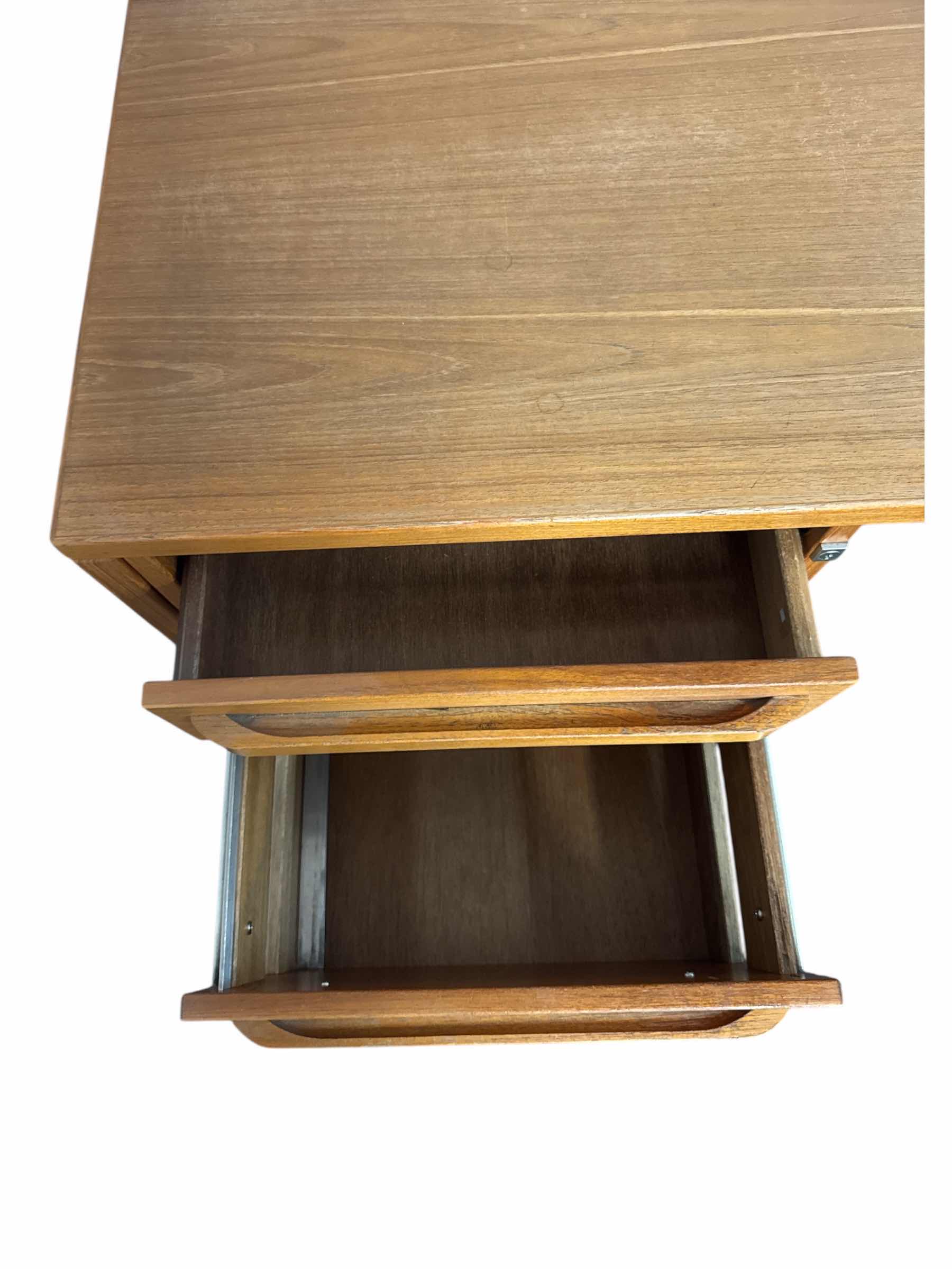 Photo 1 of ROLLING TEAKWOOD OFFICE DESK 2 DRAWER WITH LOCK NO KEY
52” X 20.5” X H27”